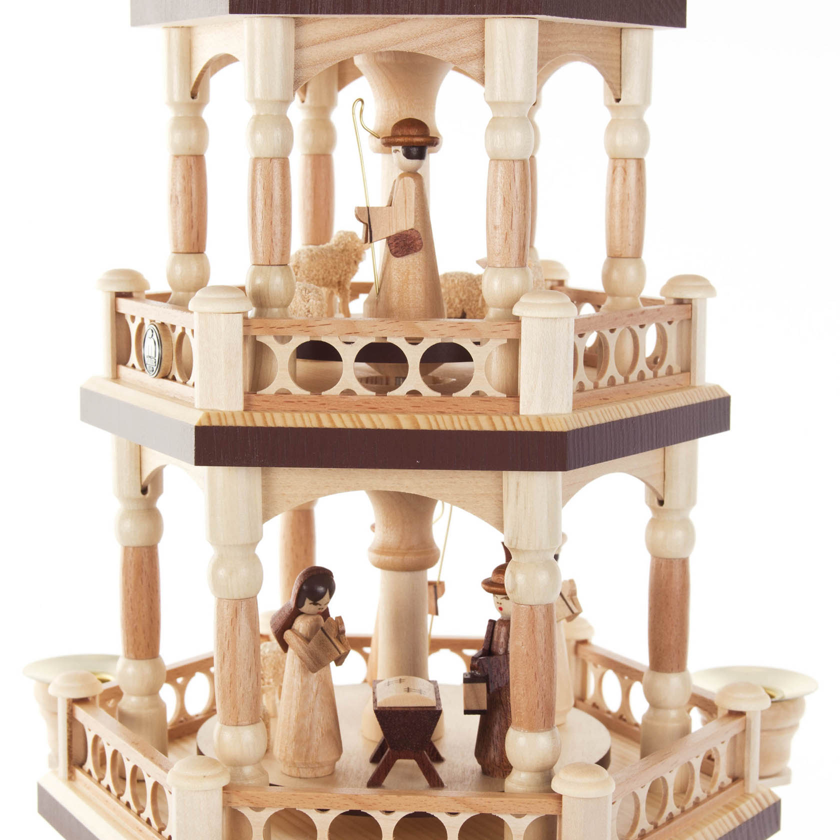 A four-tiered wooden Christmas pyramid featuring the Nativity scene, with figures representing Mary, Joseph, baby Jesus, and a shepherd with a sheep, designed for 14mm candles.