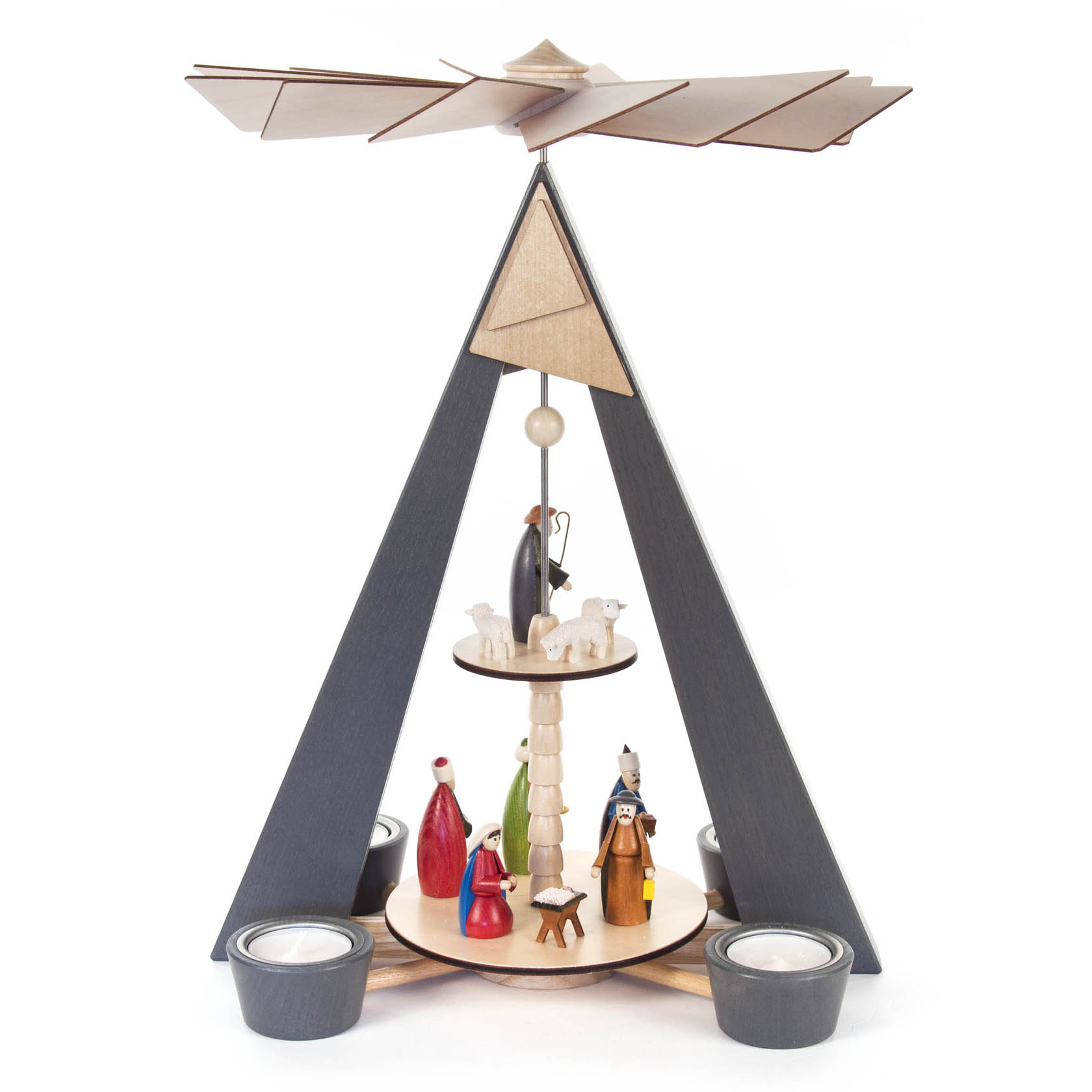 A two-tier pyramid with the nativity scene; colorful wooden figures of Mary, Joseph, and wise men, with tealight holders, set in a gray structure. im Dregeno Online Shop günstig kaufen