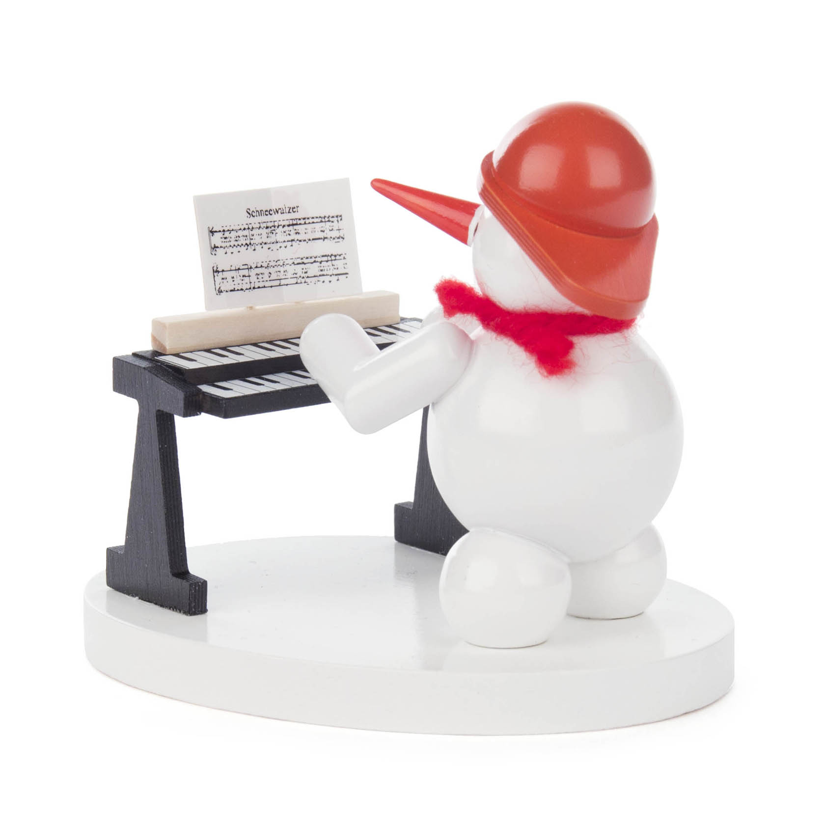 Ein Schneemann mit rotem Hut und Schal spielt Keyboard. Er schaut auf ein Notenblatt mit der Aufschrift 'Schneevalzer'.