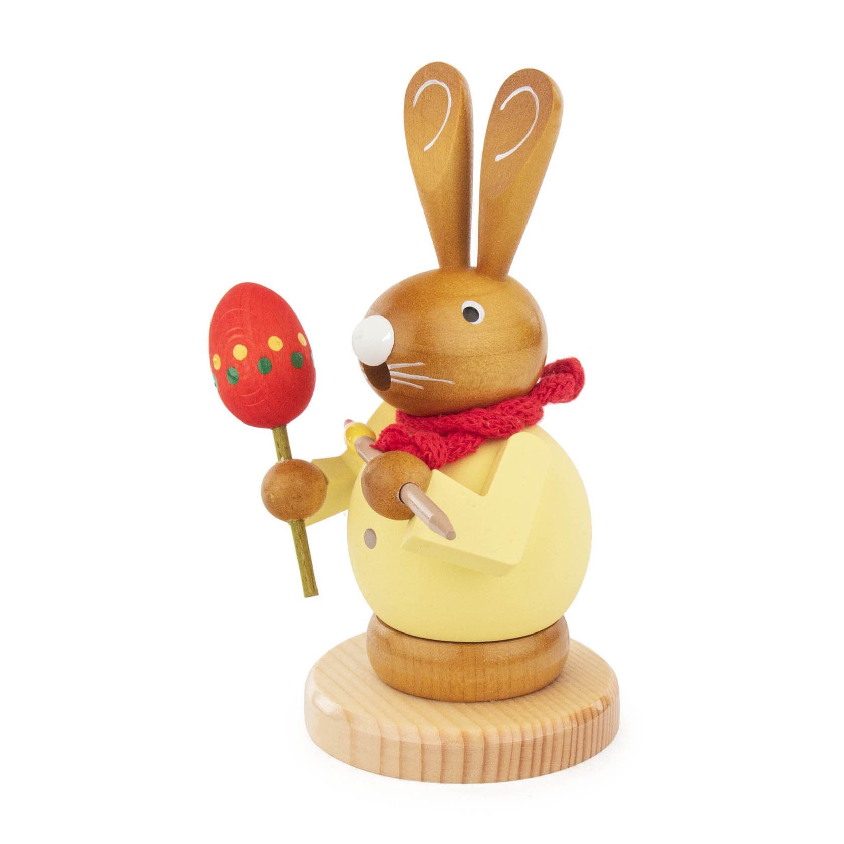 A wooden incense smoker shaped like a bunny, holding a colorful painted Easter egg on a stick, with a red scarf and big ears.