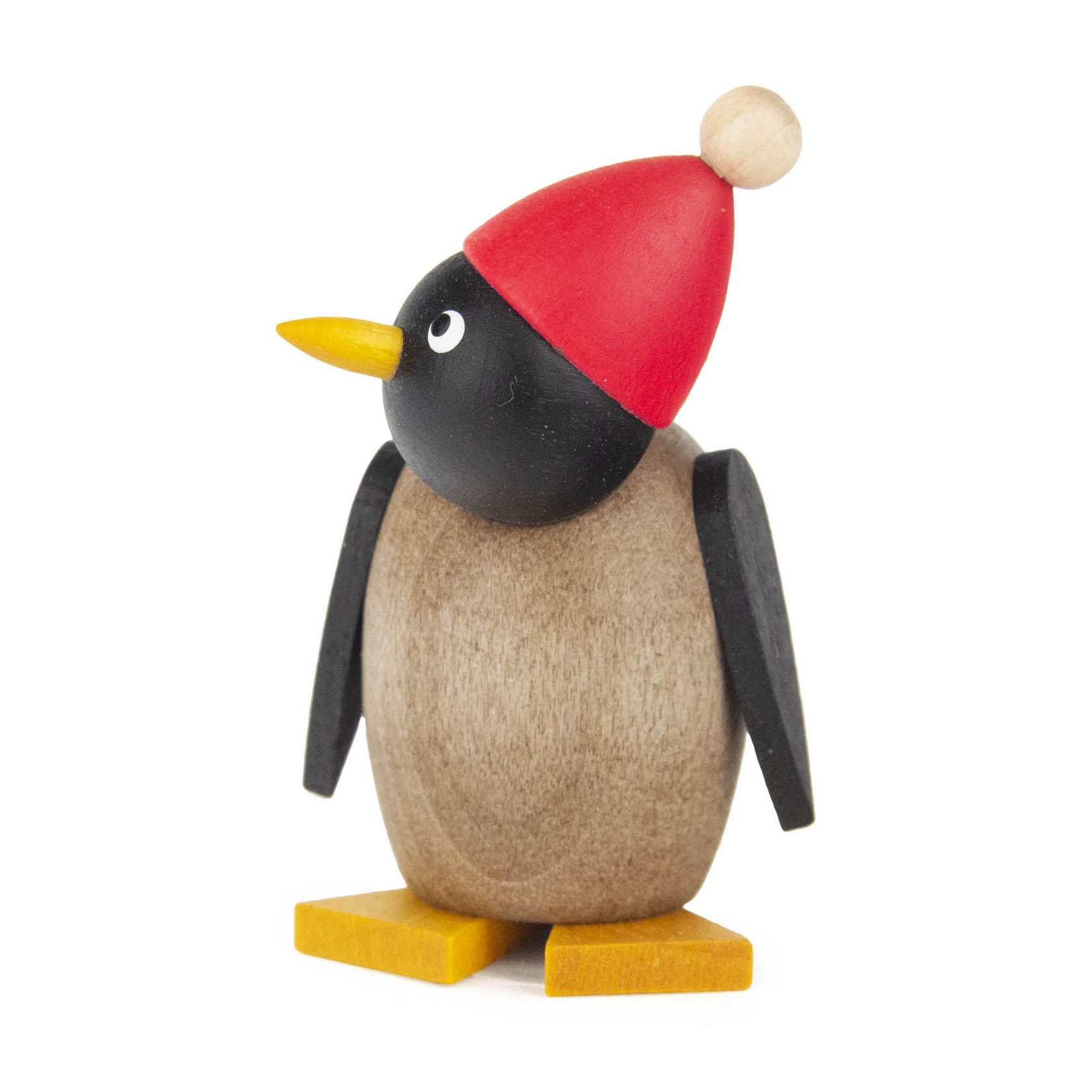 Holzfigur eines kleinen Pinguins mit grauem Körper und schwarzem Kopf, der eine rote Mütze mit einem beigen Bommel und gelbe Füße trägt. im Dregeno Online Shop günstig kaufen