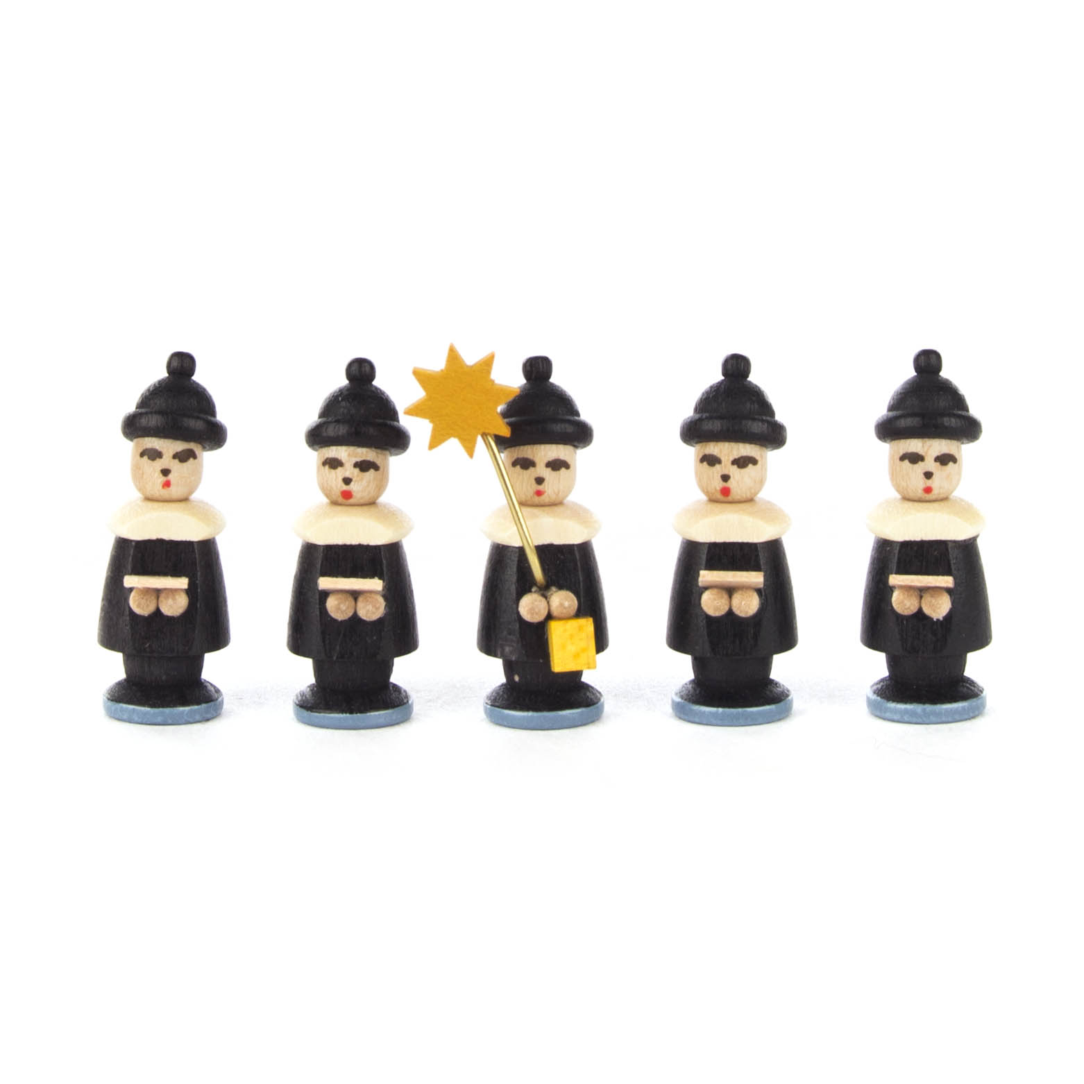 Five small wooden figurines of carol singers in traditional attire, holding song sheets, with one holding a star, arranged in a row.