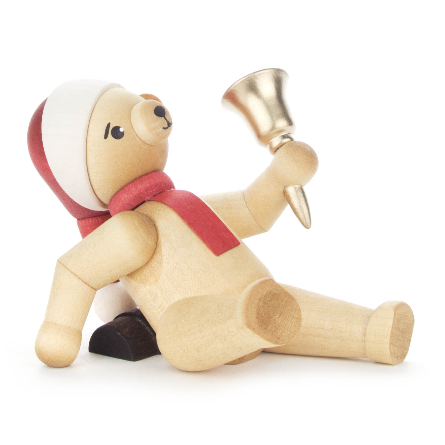 A wooden Christmas bear figurine wearing a Santa hat and red scarf, lying on its side and holding a small gold bell. im Dregeno Online Shop günstig kaufen