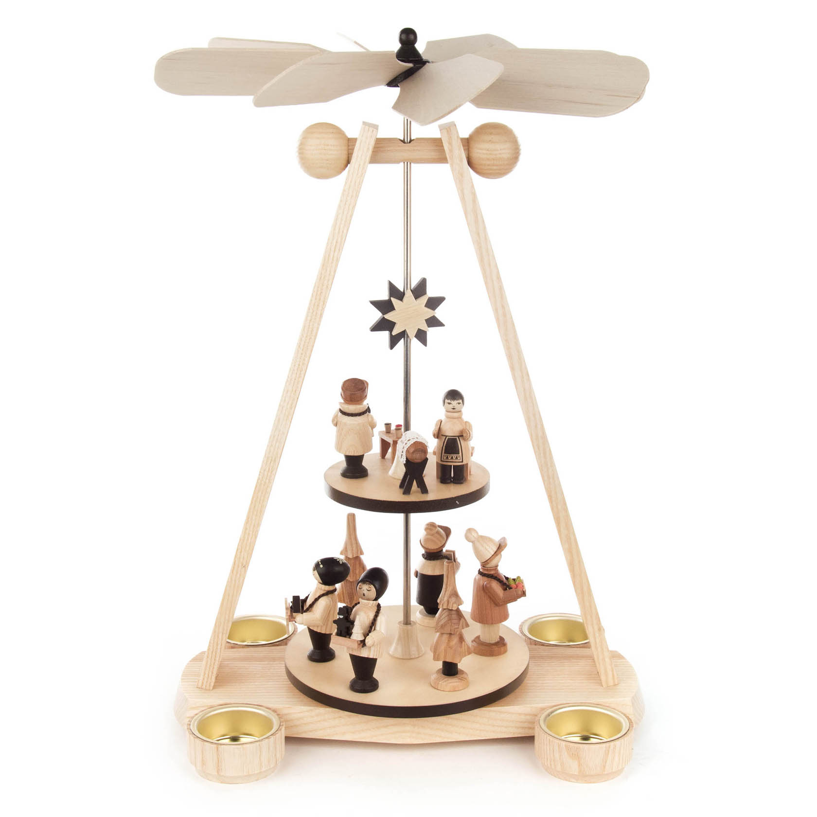 A two-tiered natural wood pyramid with candle holders at the base. Features hand-carved figurines on each tier, under a spinning fan-like top powered by candle heat.