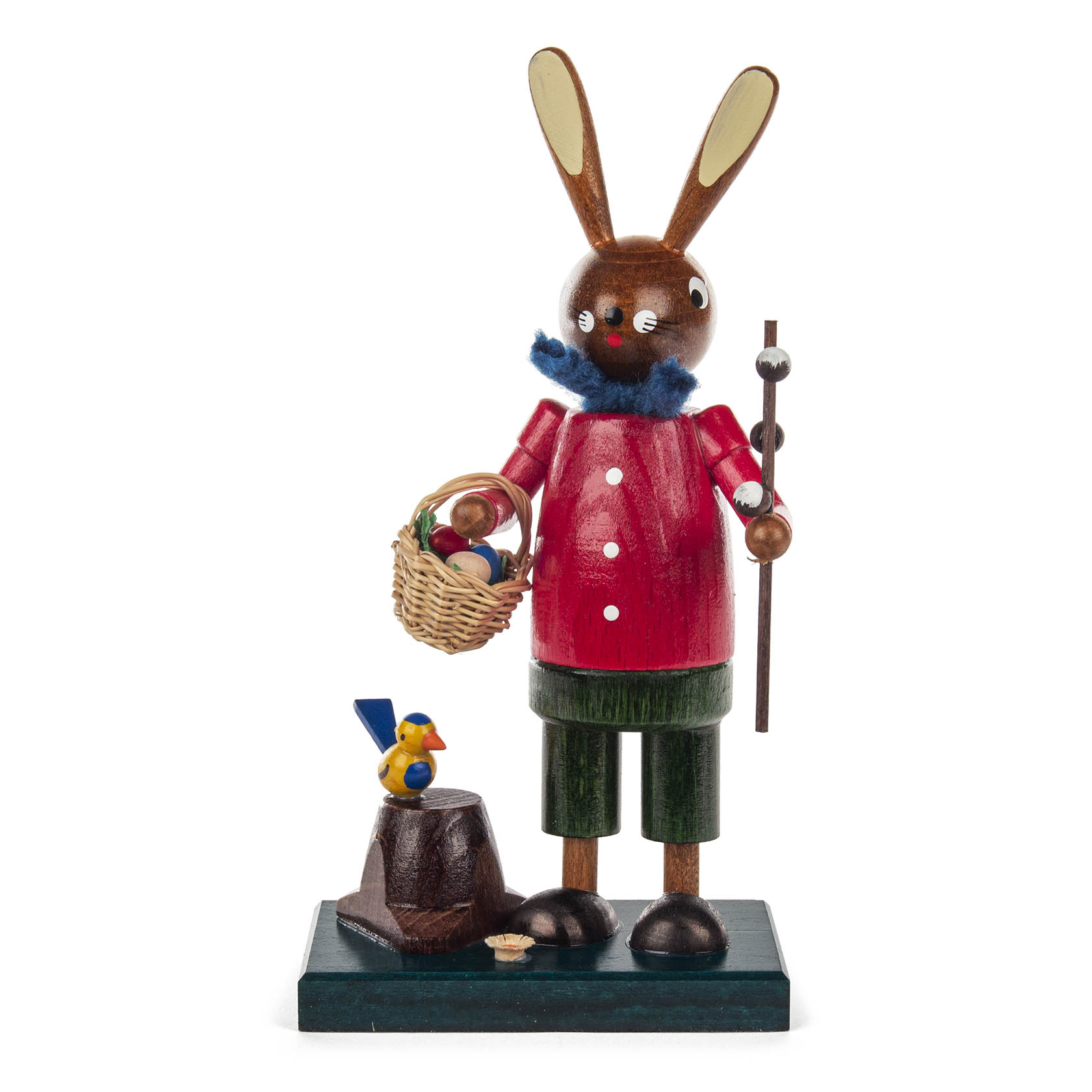 A wooden Easter bunny figure wearing a red shirt and green shorts, holding a basket with colorful eggs and a walking stick, with a small bird nearby. im Dregeno Online Shop günstig kaufen