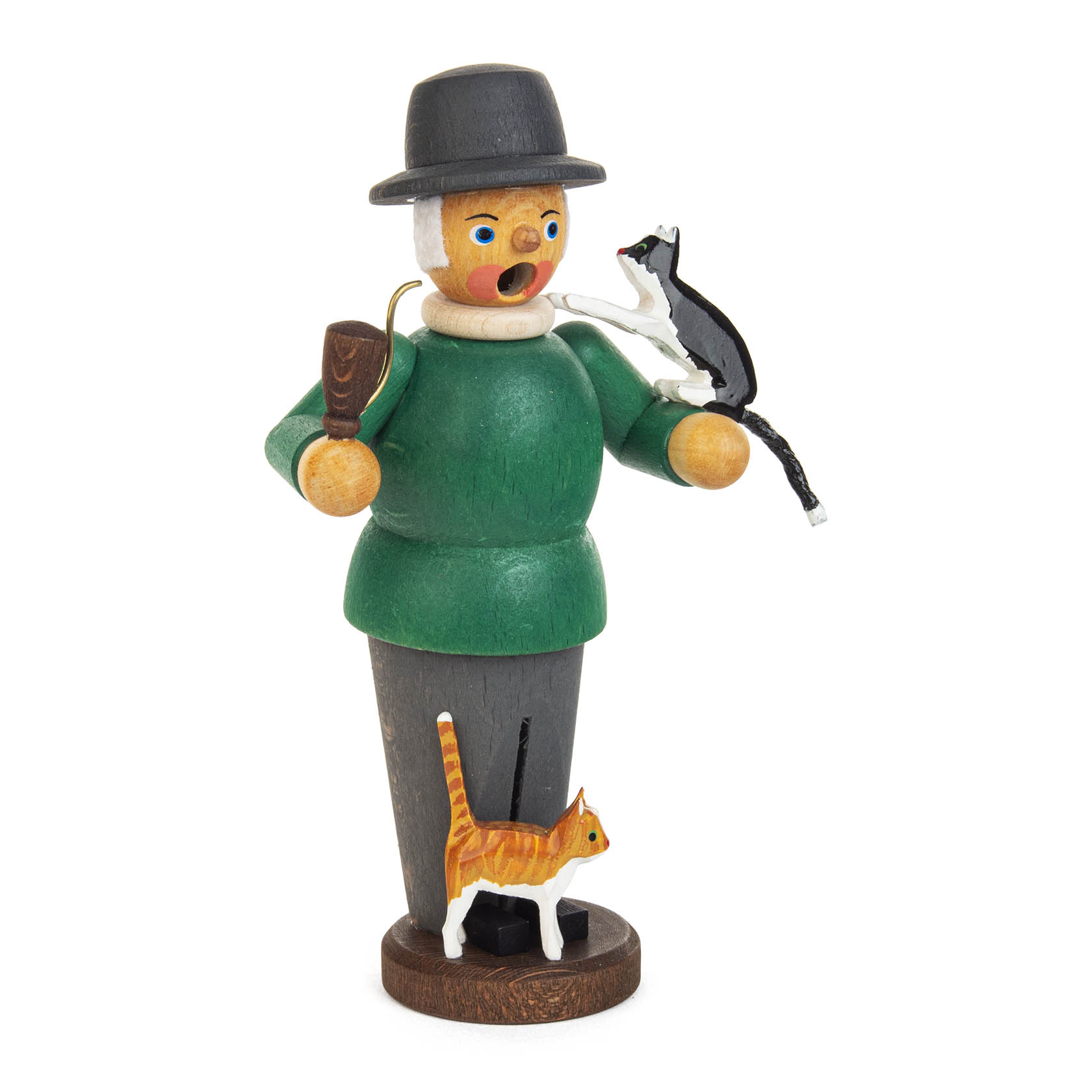 A wooden smokeman with a green coat standing, holding a walking stick and with a cat on his arm. Another cat sits at his feet.