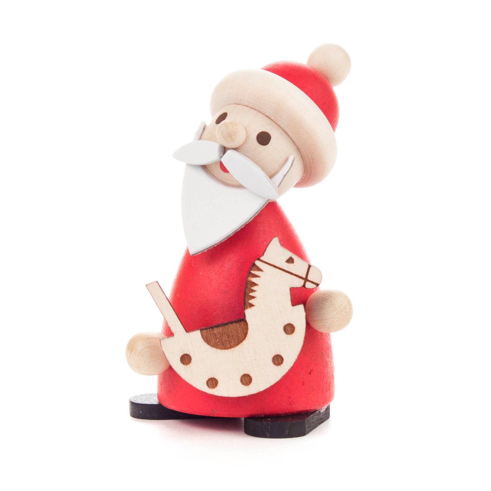A wooden figurine of Santa Claus with a red outfit, white beard, and hat, holding a small wooden rocking horse. im Dregeno Online Shop günstig kaufen