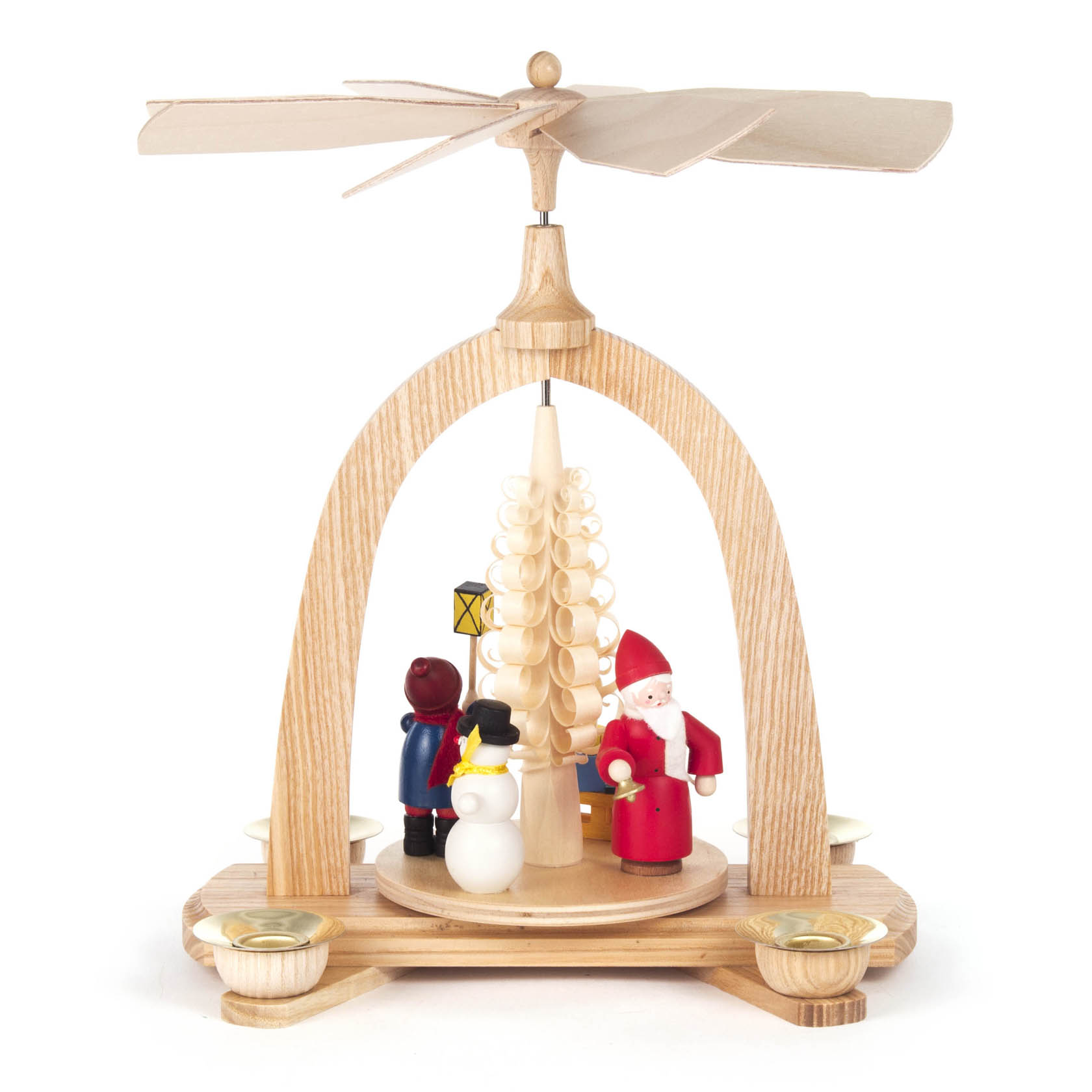 A wooden Christmas pyramid with a rotating tier featuring a Santa figurine, a snowman, and a child holding a lantern. It has candle holders.