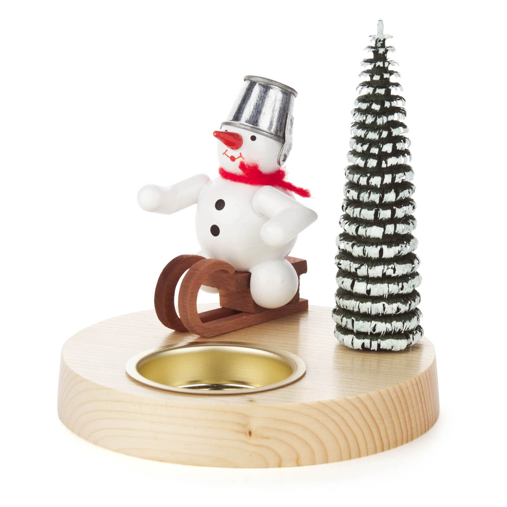 Ein Teelichthalter mit einem stilisierten Schneemann auf einem Holzschlitten, daneben steht ein Tannenbaum aus Metall. Der Halter ist aus Holz. im Dregeno Online Shop günstig kaufen