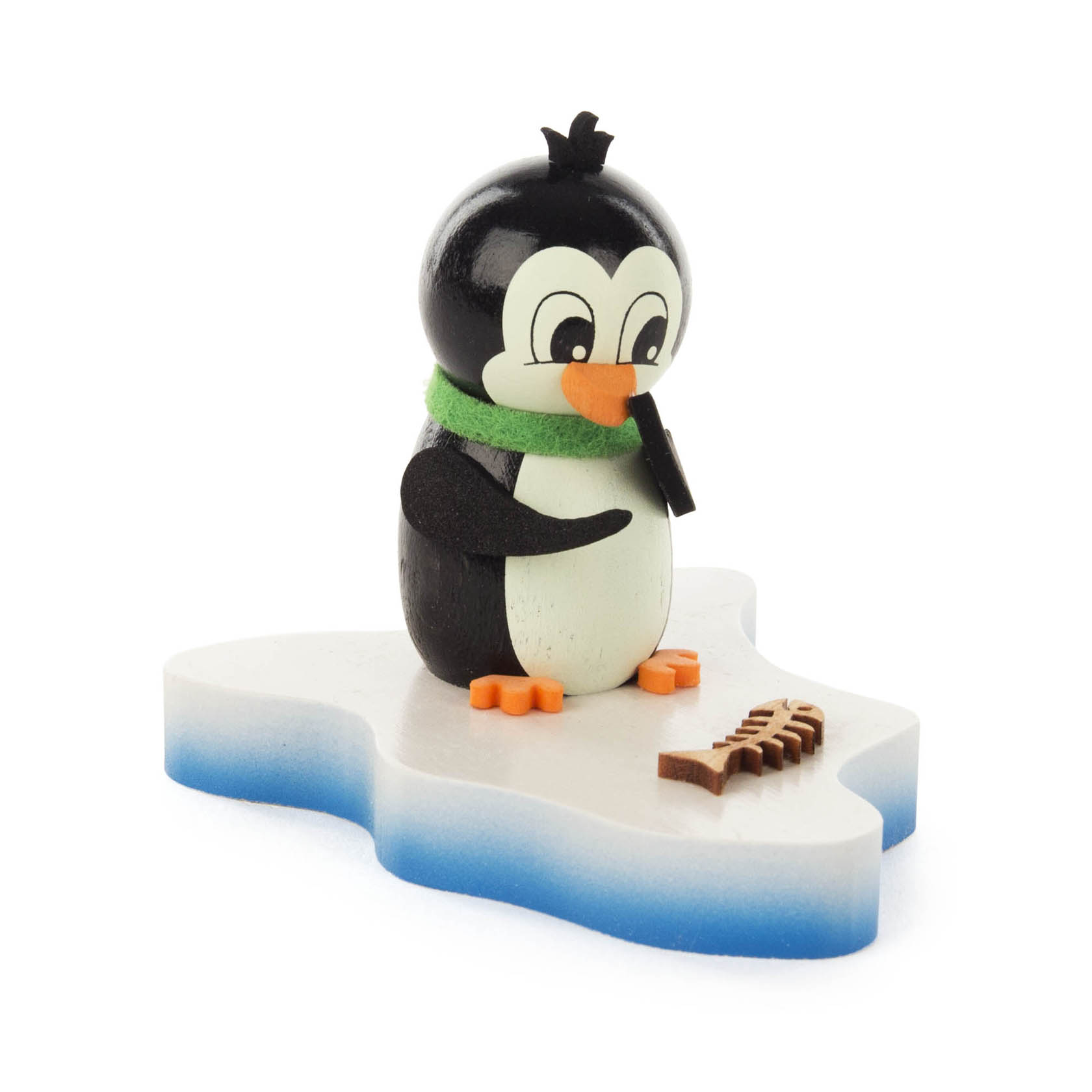 A cute wooden penguin with a green scarf stands on a small ice floe, looking at a fish skeleton with curiosity.