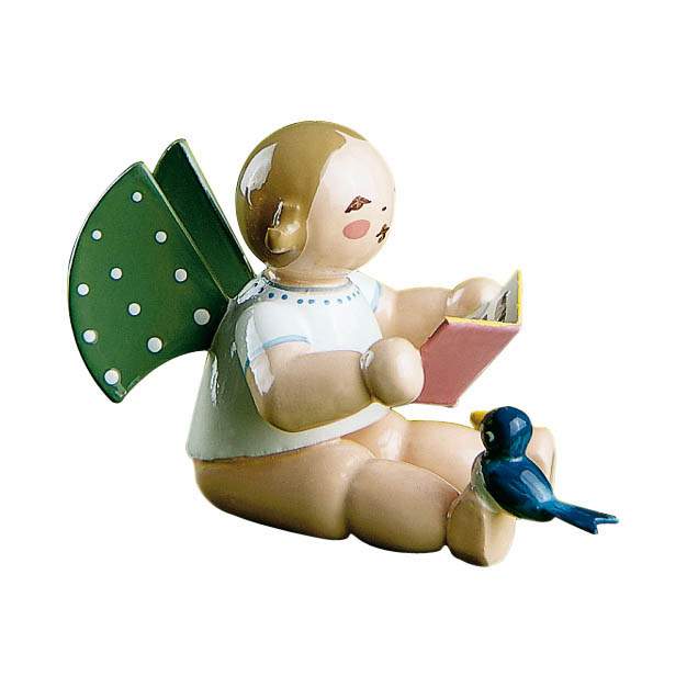 Porcelain angel figurine with green wing and white dots, sitting and holding a music sheet, with a small blue bird beside it. im Dregeno Online Shop günstig kaufen