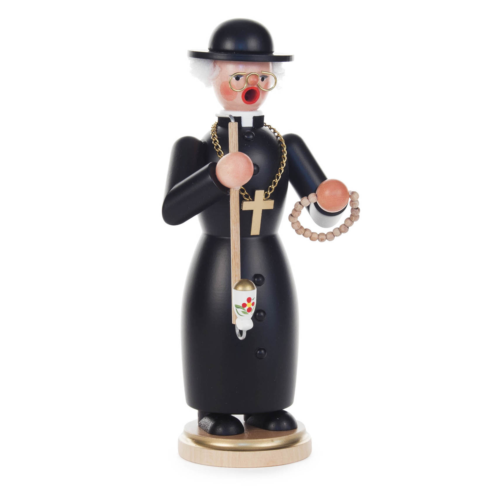 Ein Räuchermann in Form eines Pastors mit schwarzem Hut und Mantel, Goldkette mit Kreuz, Pfeife und Rosenkranz in den Händen. im Dregeno Online Shop günstig kaufen