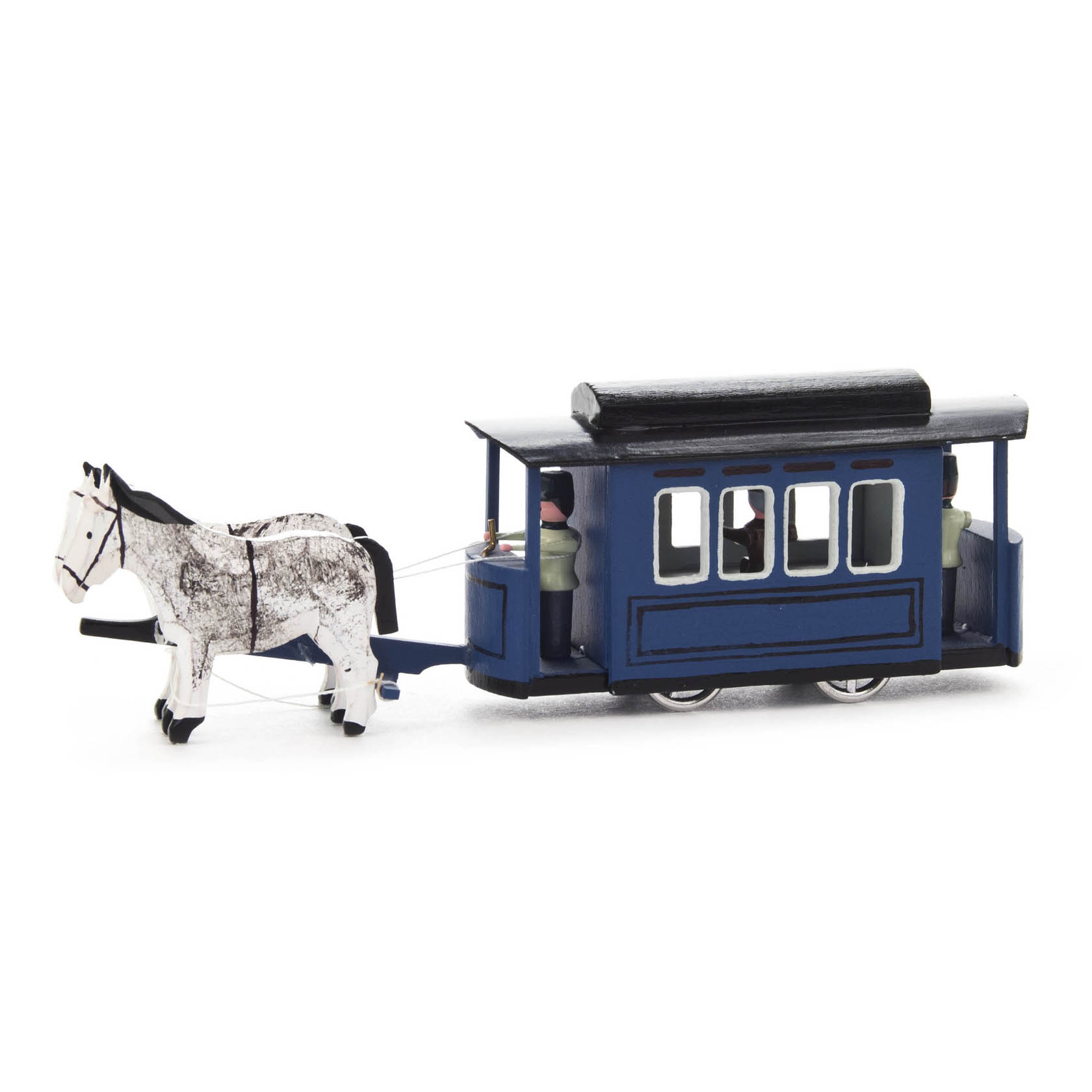 A small blue model tramcar pulled by a white horse. Inside, miniature figures are seated, visible through the windows of the tramcar.