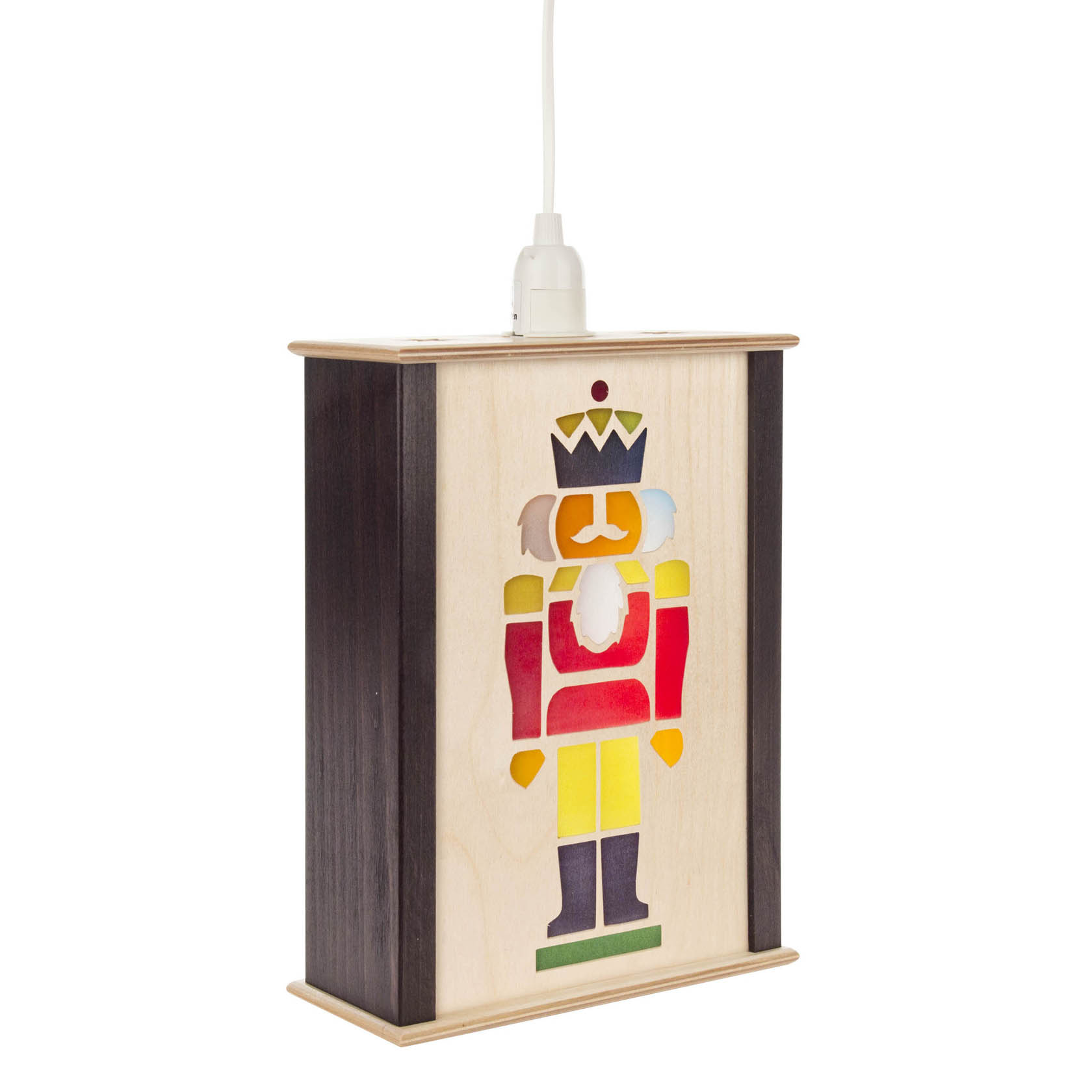 A small window lantern featuring a colorful nutcracker design with a crown, beard, and scepter on a wooden surface.