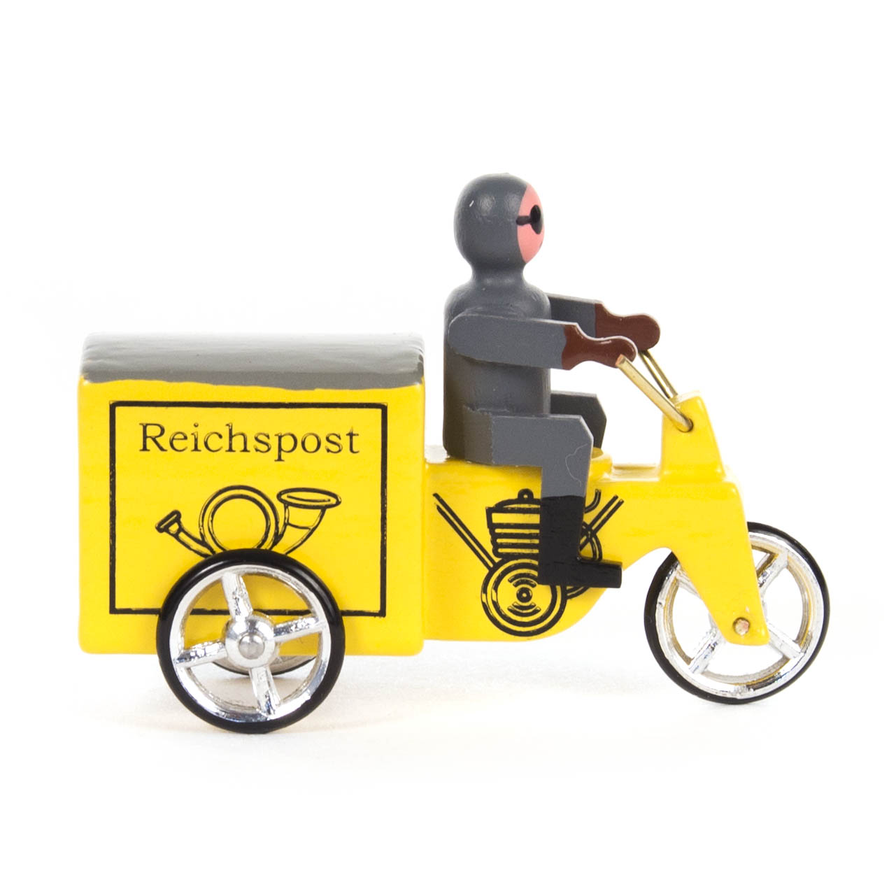A miniature yellow tricycle with a side box labeled 'Reichspost' and a gray, humanoid figure seated and wearing a helmet.