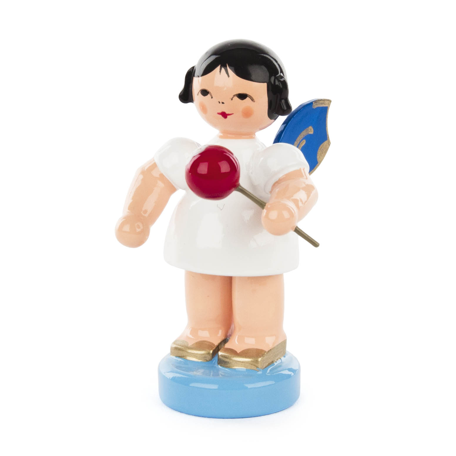 Figur eines Engels mit schwarzem Haar und blauen Flügeln, der einen roten kandierten Apfel in der rechten Hand hält.
