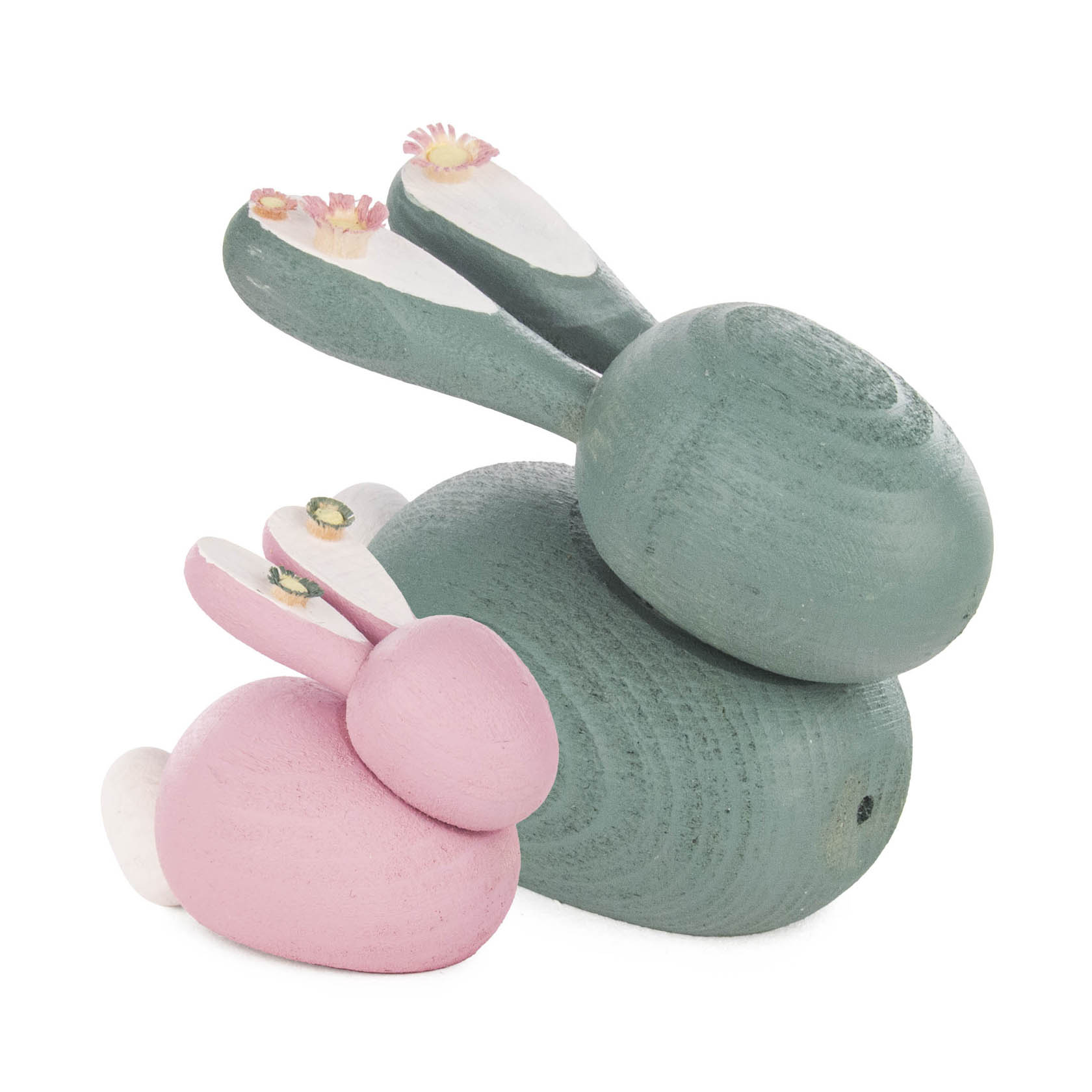 Two wooden rabbit figures in pastel colors, a larger green rabbit and a smaller pink rabbit, both with flower decorations on their ears.