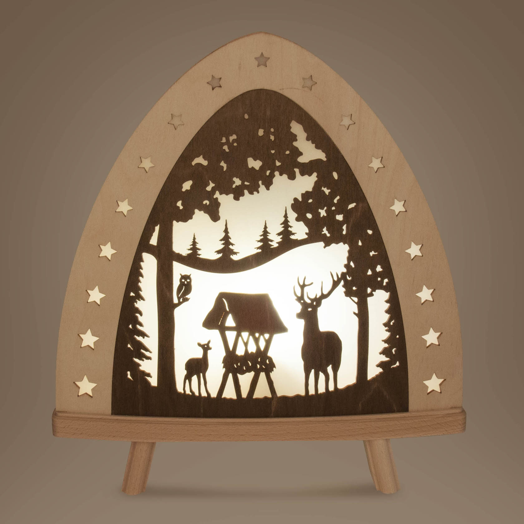 LED floor lamp featuring a cut-out silhouette of a deer family in a forest with a wooden feeder, surrounded by trees and stars.