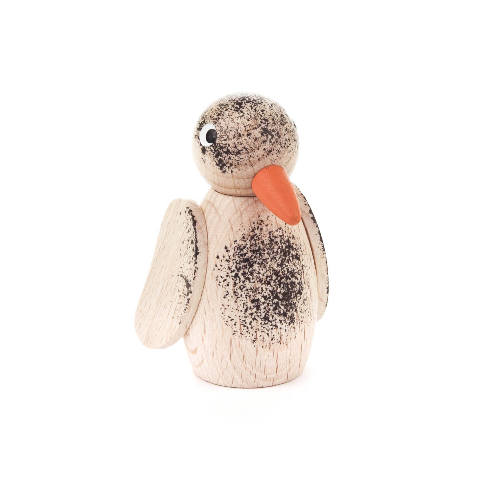 A small wooden bird figure with a smooth, natural finish. It has a distinct orange beak and painted black speckles resembling feathers.