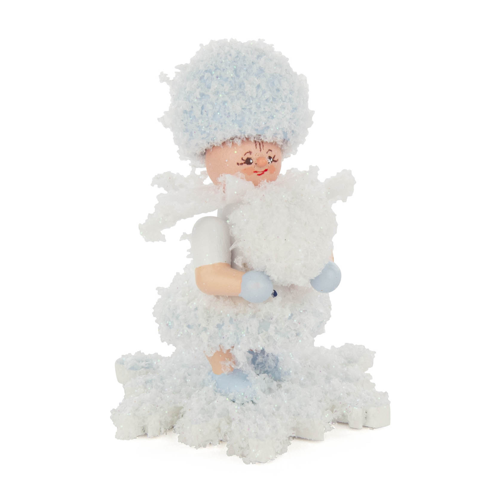 A figurine of a child dressed in fluffy, textured snow-like clothing, holding a snowball, with a cheerful expression. im Dregeno Online Shop günstig kaufen