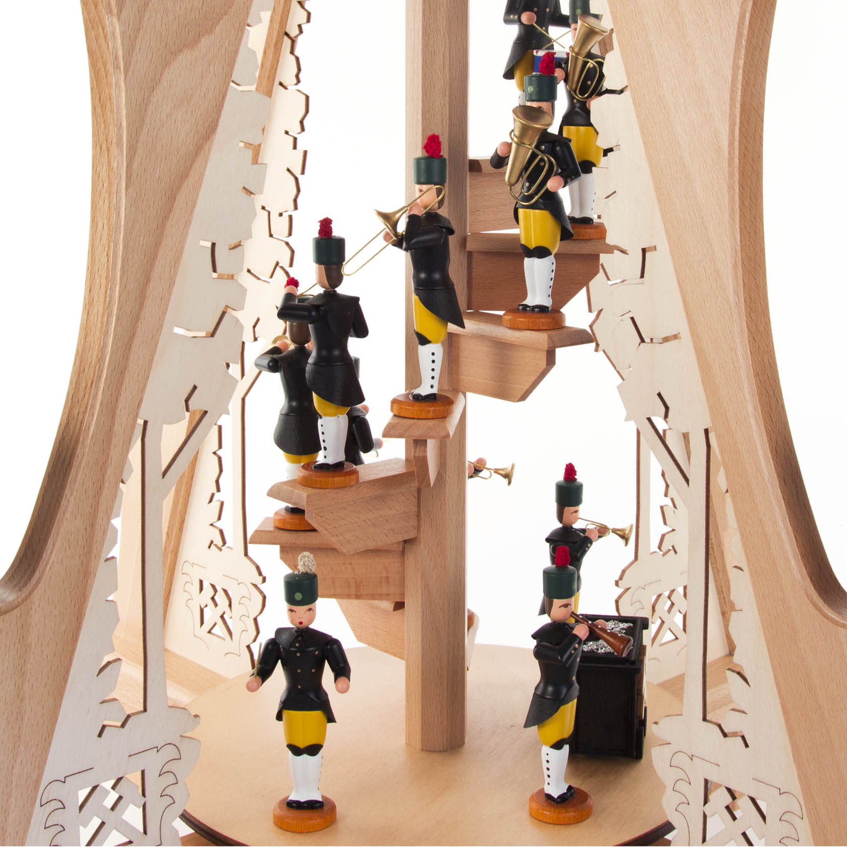Wooden pyramid with miners in traditional uniforms, featuring electric lighting and moving elements. The structure is ornate with intricate carvings.