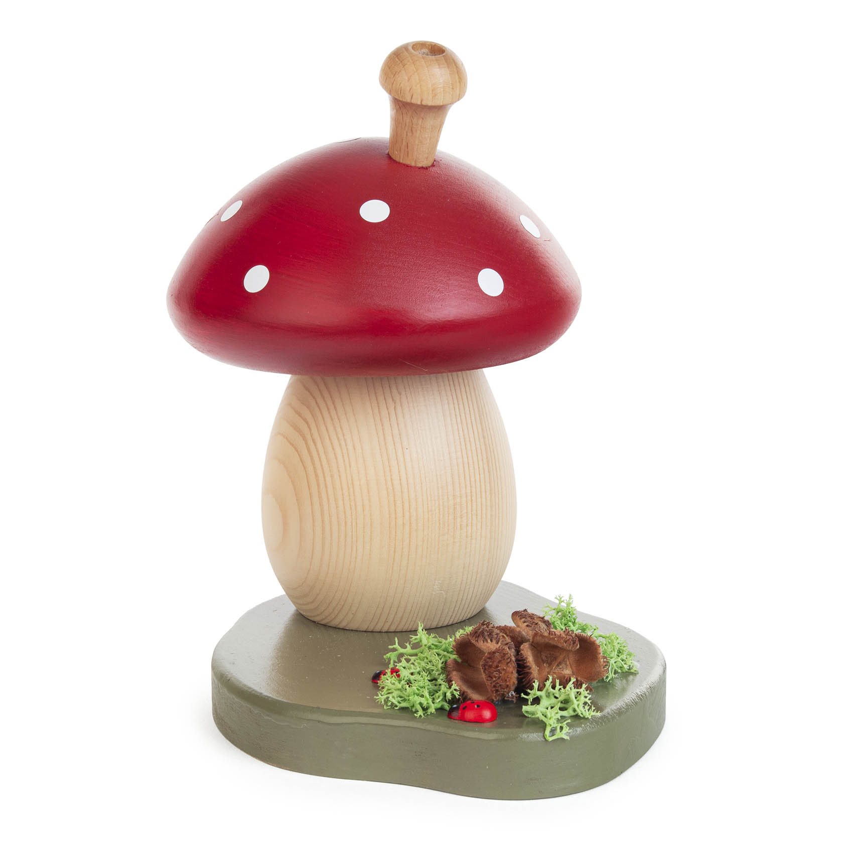 Dekorativer Räucherpilz in Form eines großen Fliegenpilzes mit rotem Hut und weißen Punkten, auf einem Sockel mit Moos und kleinen Pilzminiaturen.