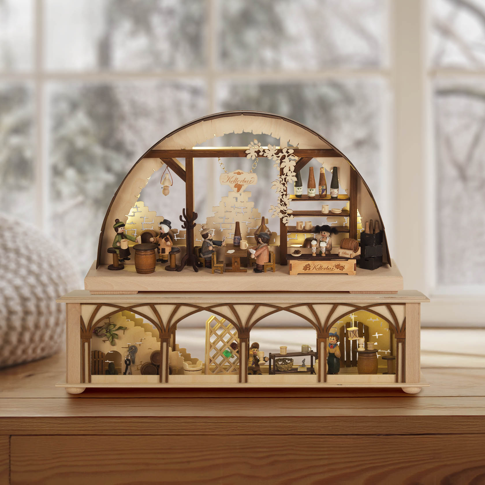A small, electronically lit Schwibbogen depicting a cozy cellar bar scene with figurines, bottles, and barrels, set on a wooden base.