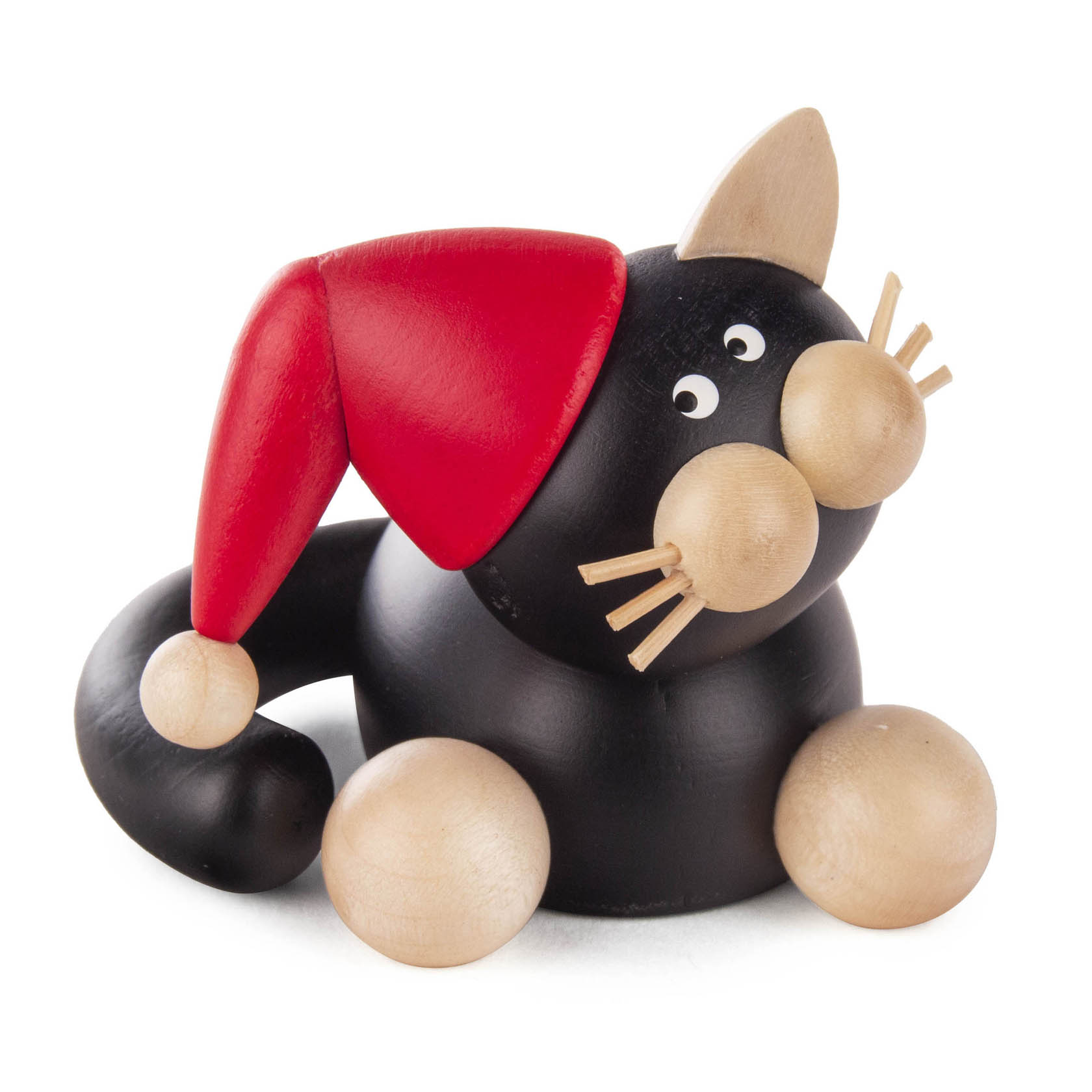 Holzfigur einer schwarz-weißen Katze mit Weihnachtsmütze, kugeligen Pfoten und Schnurrhaaren, sitzend. im Dregeno Online Shop günstig kaufen