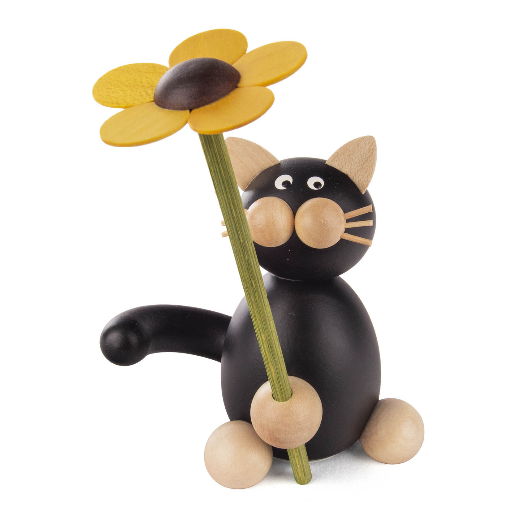 Holzfigur einer schwarzen Katze mit großen Augen, die eine gelbe Blume mit brauner Mitte hält. im Dregeno Online Shop günstig kaufen
