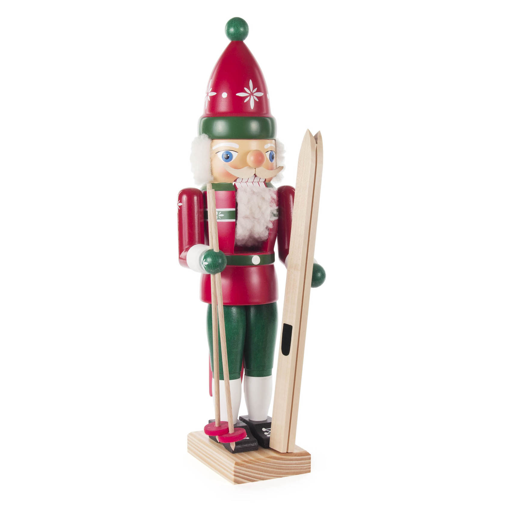 Wooden nutcracker dressed as a skier with red and green attire, holding wooden skis and ski poles, standing on a wooden base.