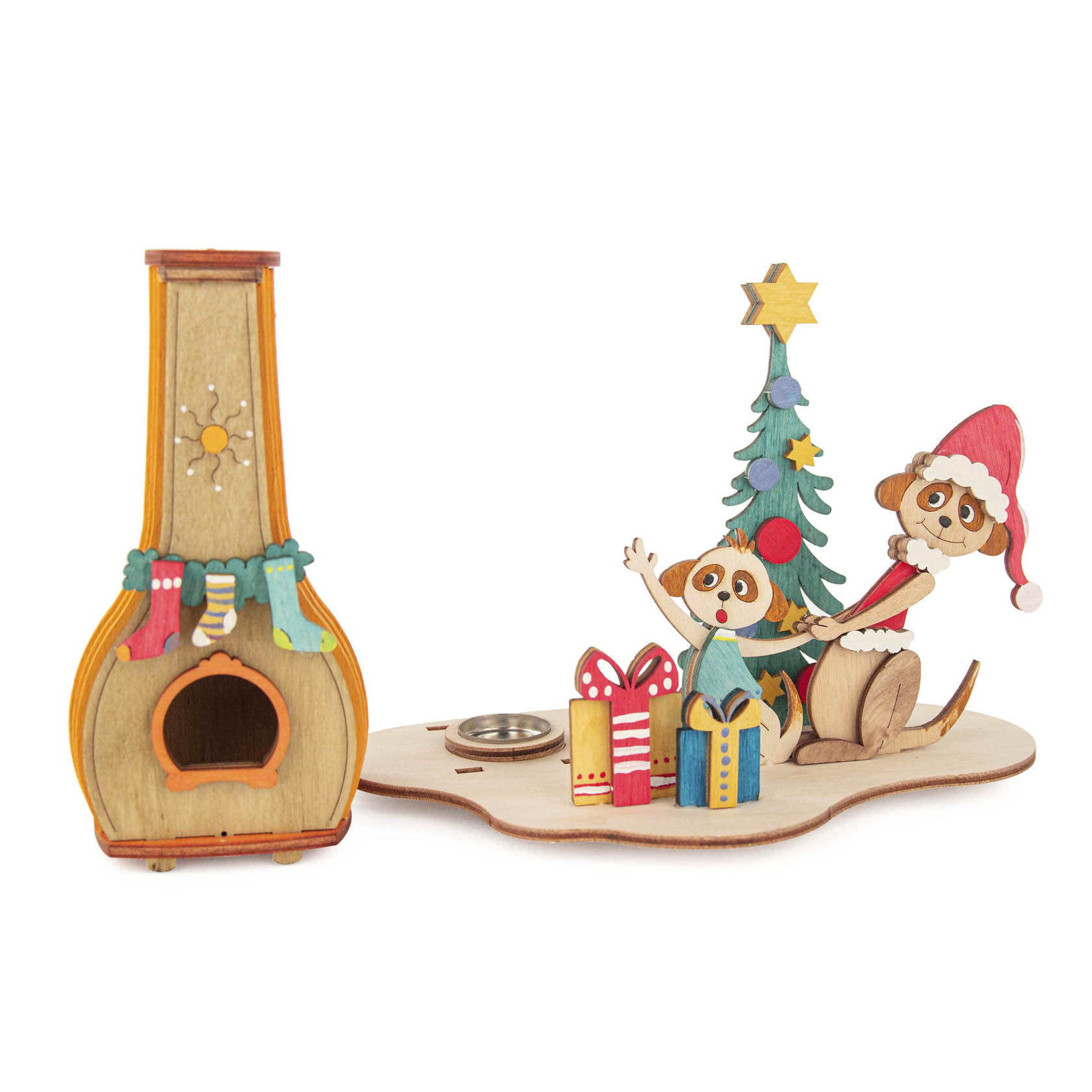 A wooden meerkat incense smoker set with a meerkat family in front of a Christmas tree, surrounded by gifts, next to a small decorated chimney.