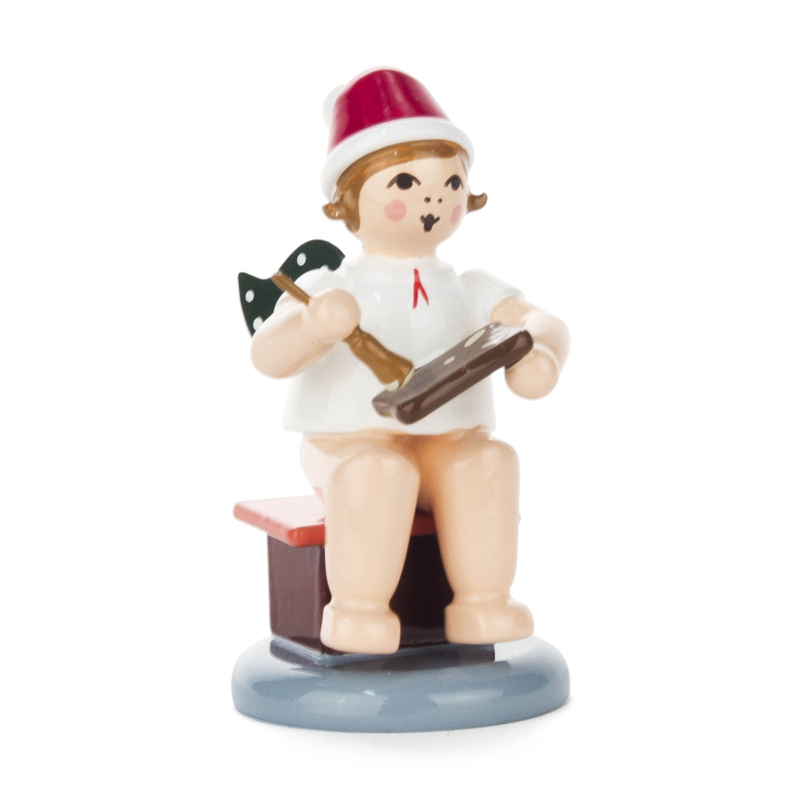 Bäckerengel mit Pfefferkuchen und Mütze, sitzend im Dregeno Online Shop günstig kaufen