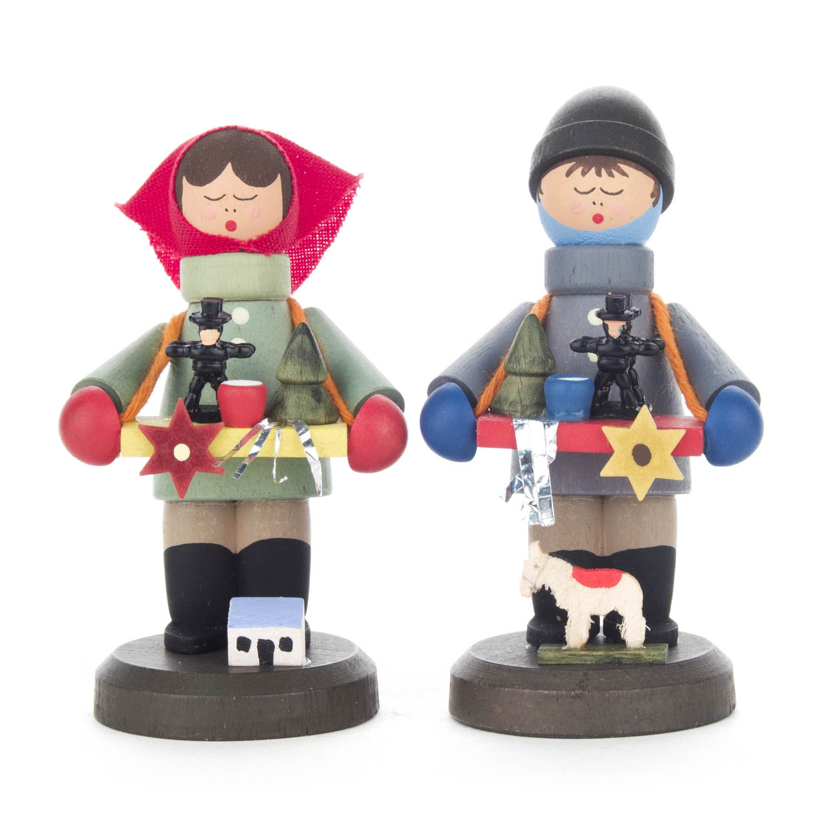 Two wooden figures, a boy and a girl, dressed in winter attire. Each holds a tray with small incense burners and star decorations. im Dregeno Online Shop günstig kaufen