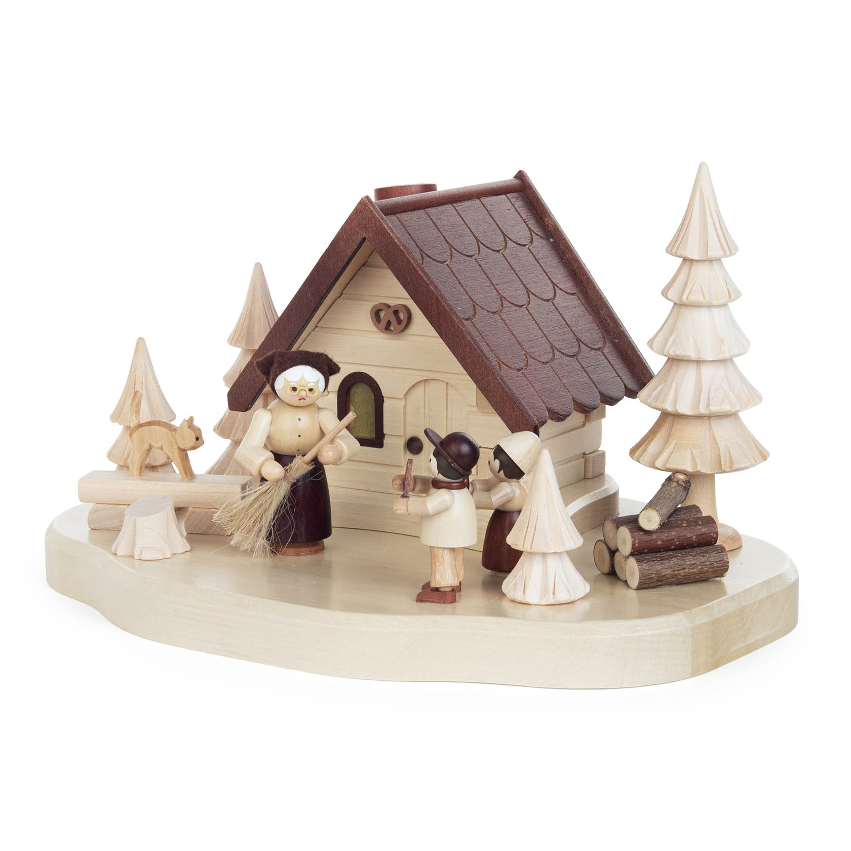 Wooden figurine set depicting a fairytale scene with a witch outside a small house, accompanied by two children and several stylized trees.