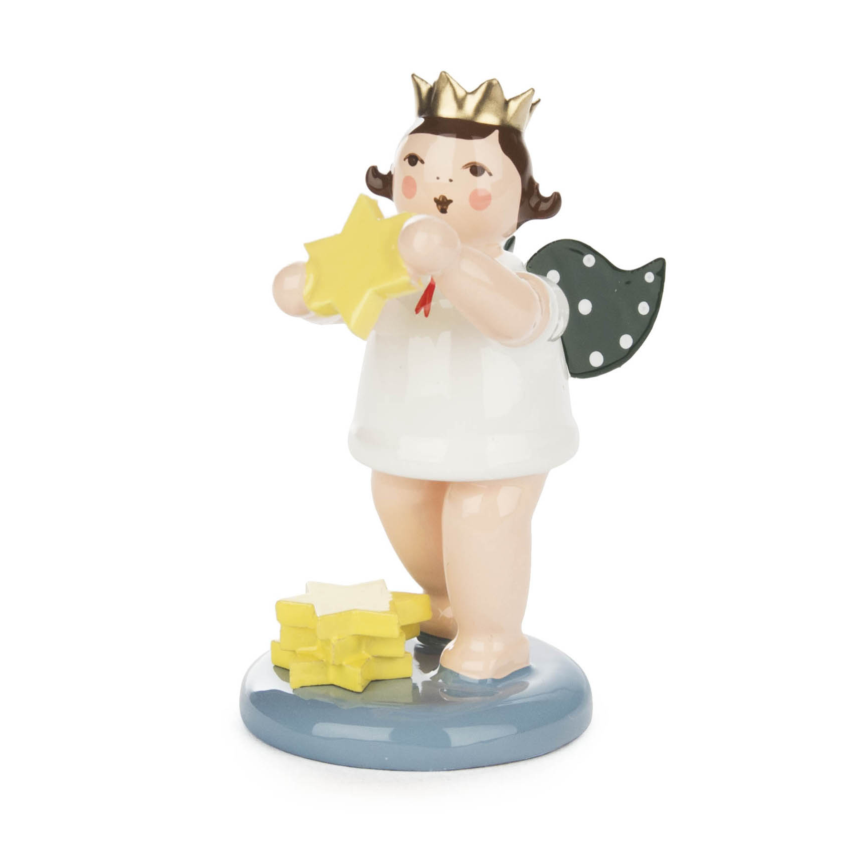 A porcelain angel figurine with a golden crown and green wings, holding a yellow star. It stands on a blue base next to a stack of stars. im Dregeno Online Shop günstig kaufen