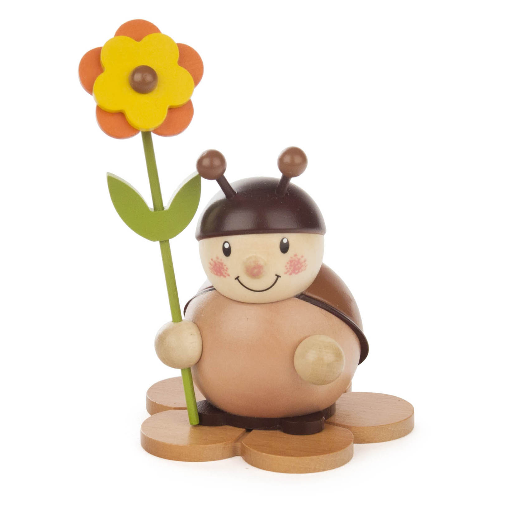 A wooden ladybug figurine with a smiling face, holding a colorful flower on the right side. im Dregeno Online Shop günstig kaufen