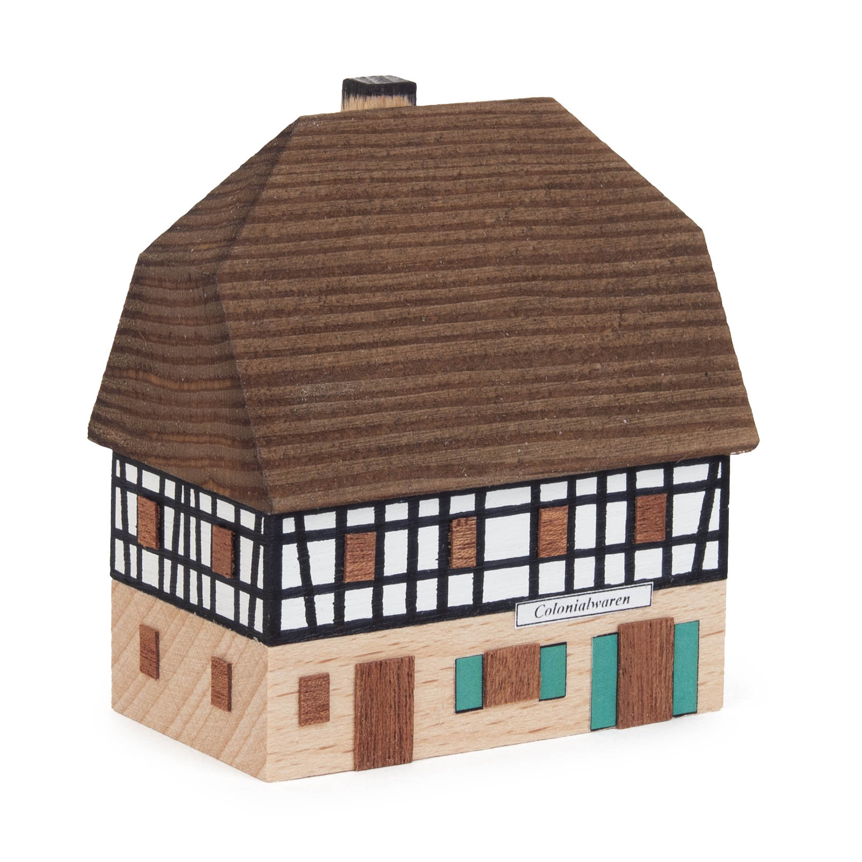 Miniatur eines zweistöckigen Fachwerk-Dorfladens mit Schild 'Colonialwaren', braunem Dach und grünen Türen. im Dregeno Online Shop günstig kaufen