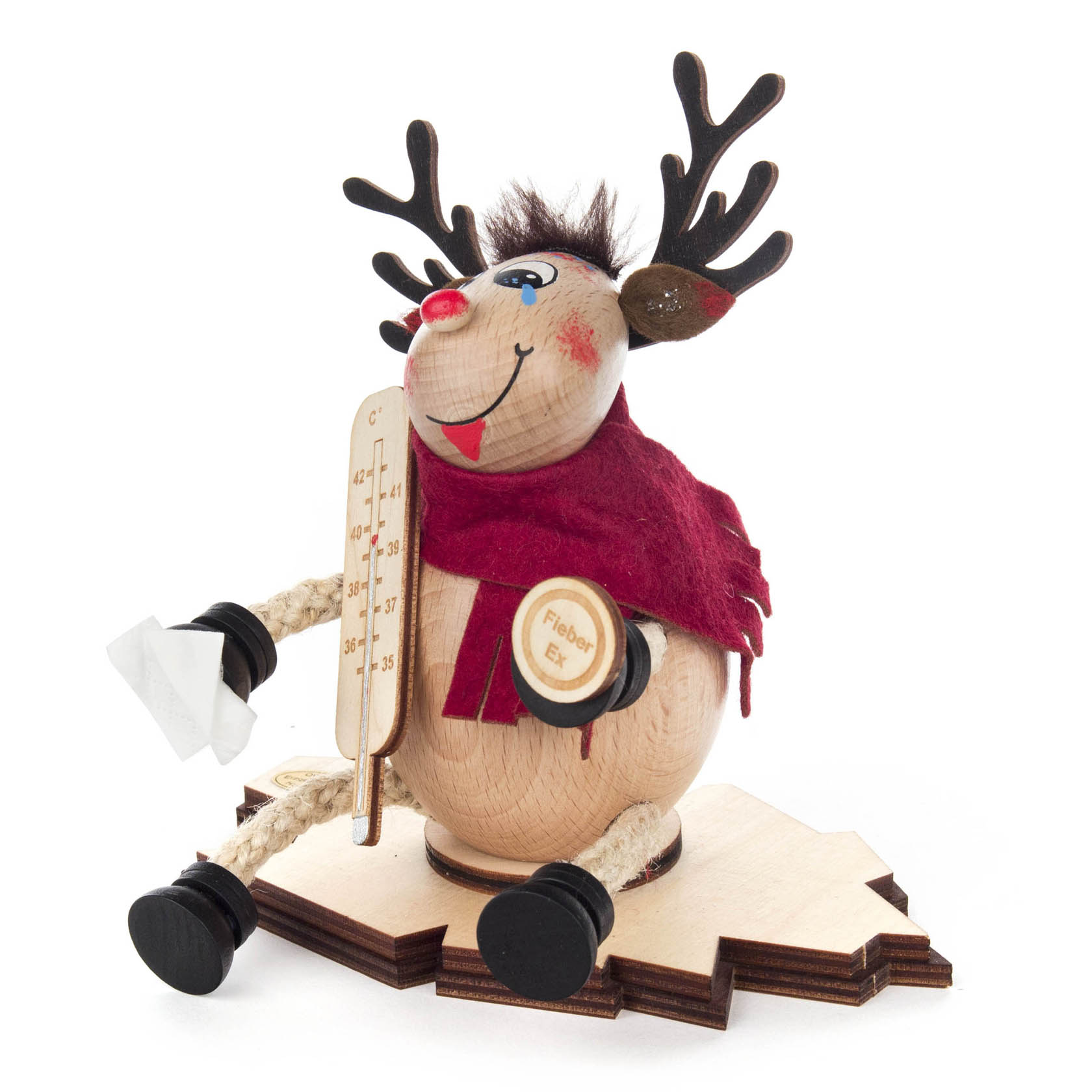 A wooden incense moose figurine named Carlson, wearing a red scarf, with a thermometer and fever patch, holding a tissue.