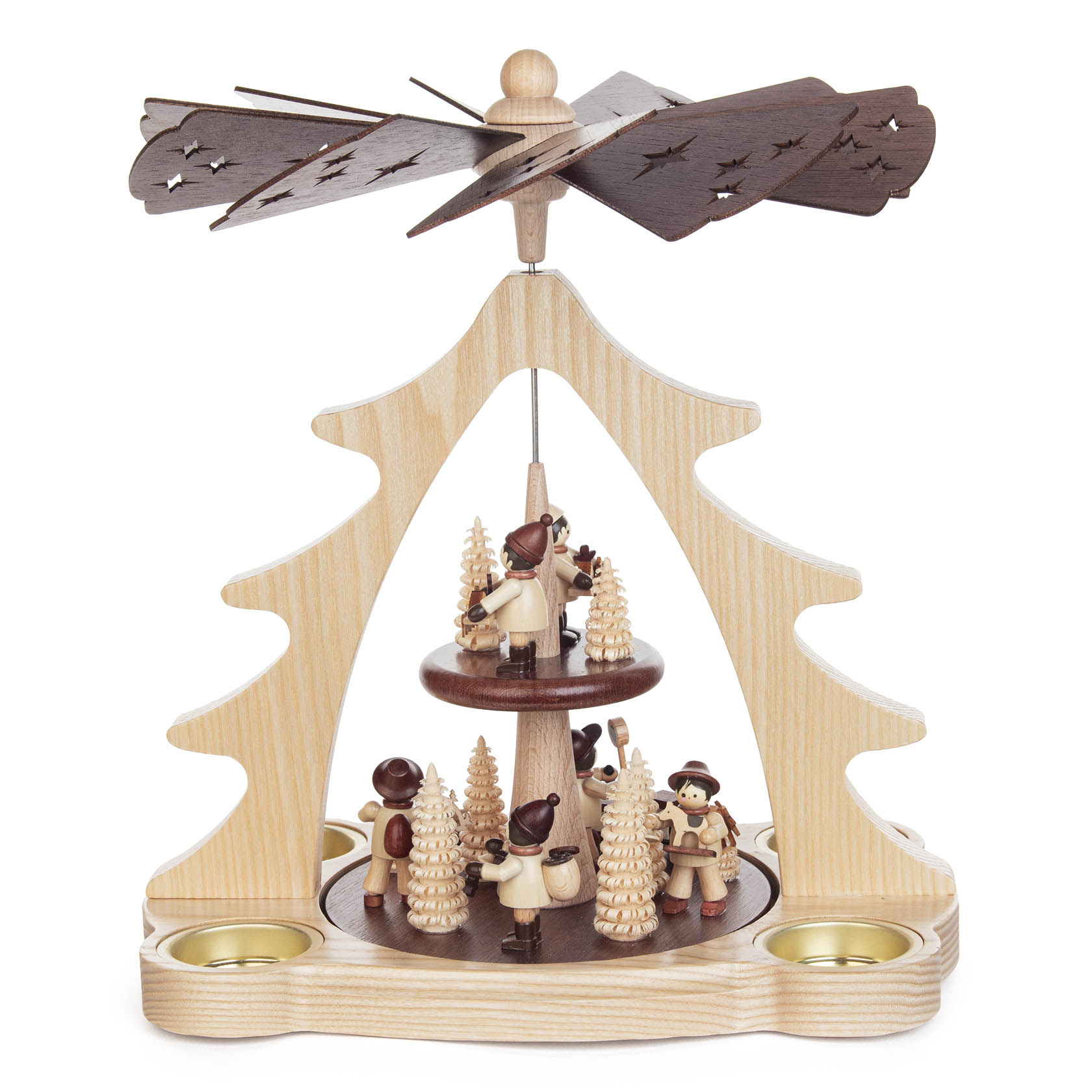 A wooden Christmas pyramid with small handcrafted figures of children playing and small trees, topped with a spinning propeller.