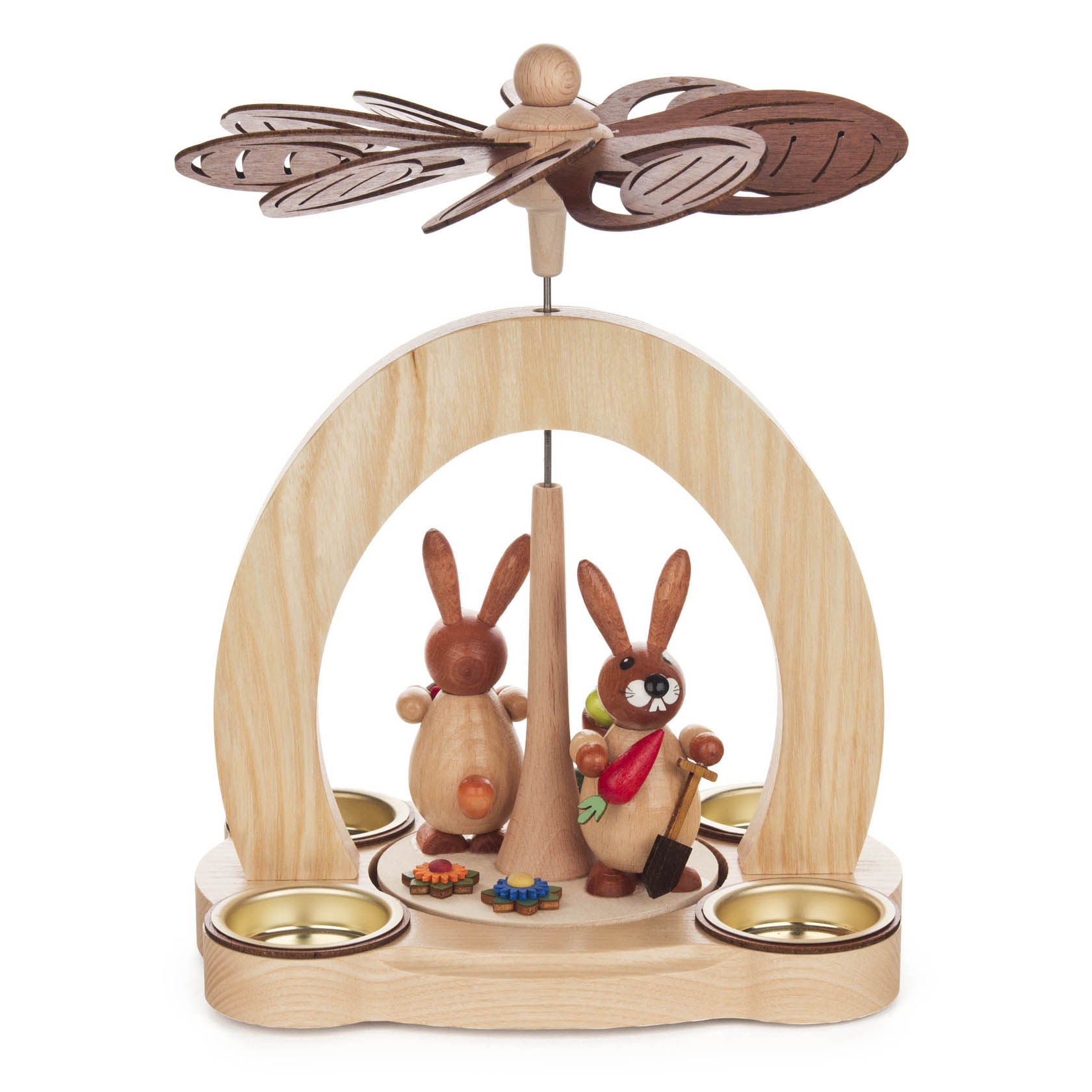 Wooden pyramid with two bunny figures holding flowers, designed for tea lights. The structure is topped with a wooden propeller.