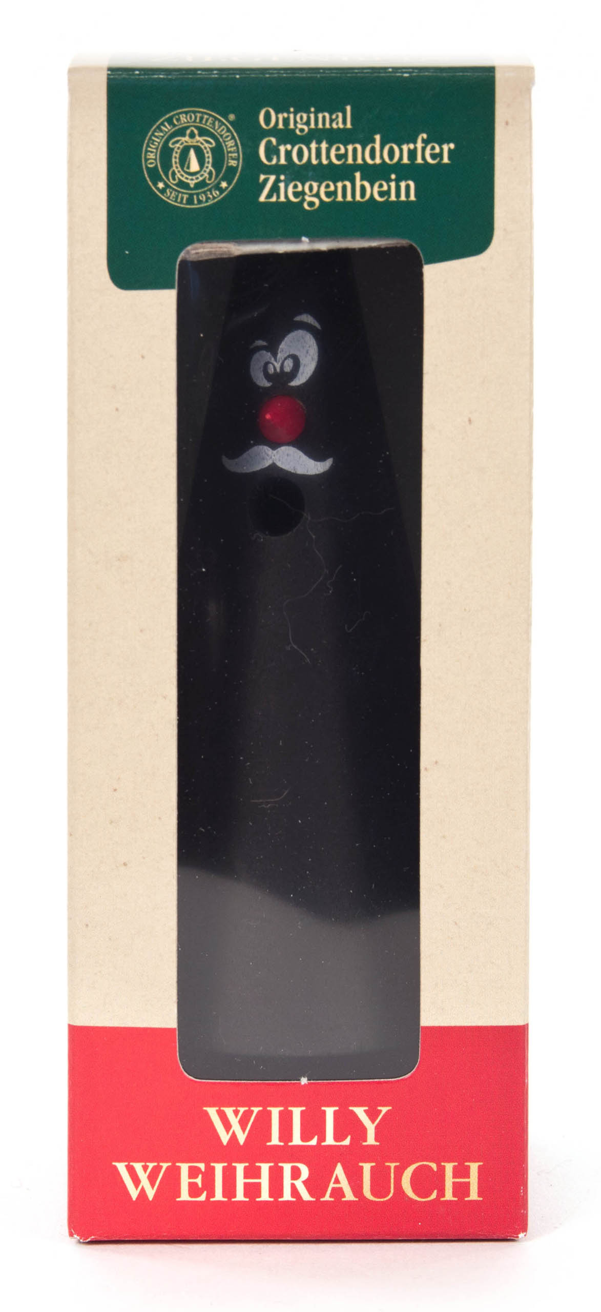 Räucherfigur 'Willy Weihrauch' in Form eines schwarzen Ziegenbeins, mit weißen Augen, roter Nase und einem Lächeln.