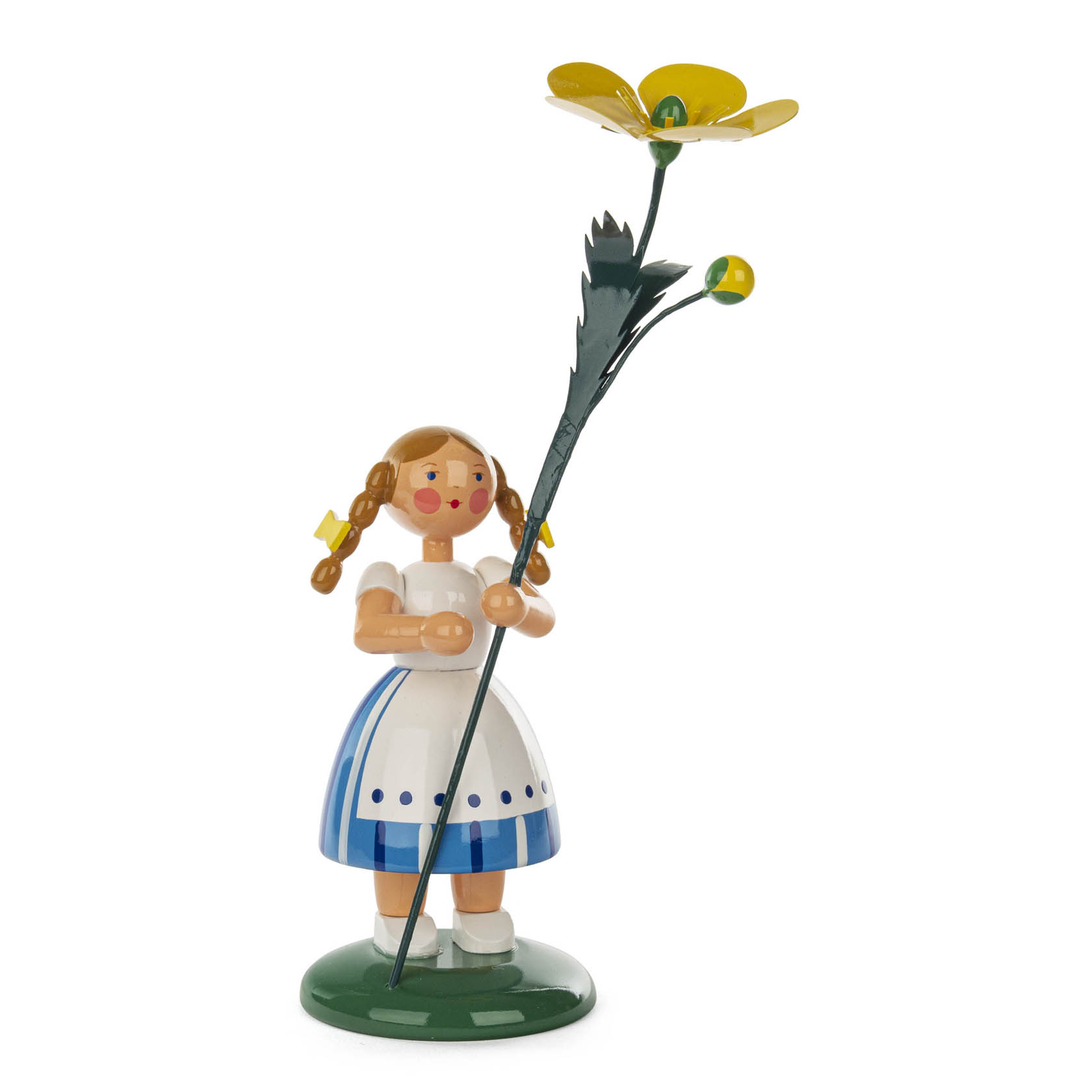 A wooden figure of a girl in a white and blue dress holding a large yellow buttercup flower, standing on a green base. She has braided hair with yellow bows. im Dregeno Online Shop günstig kaufen