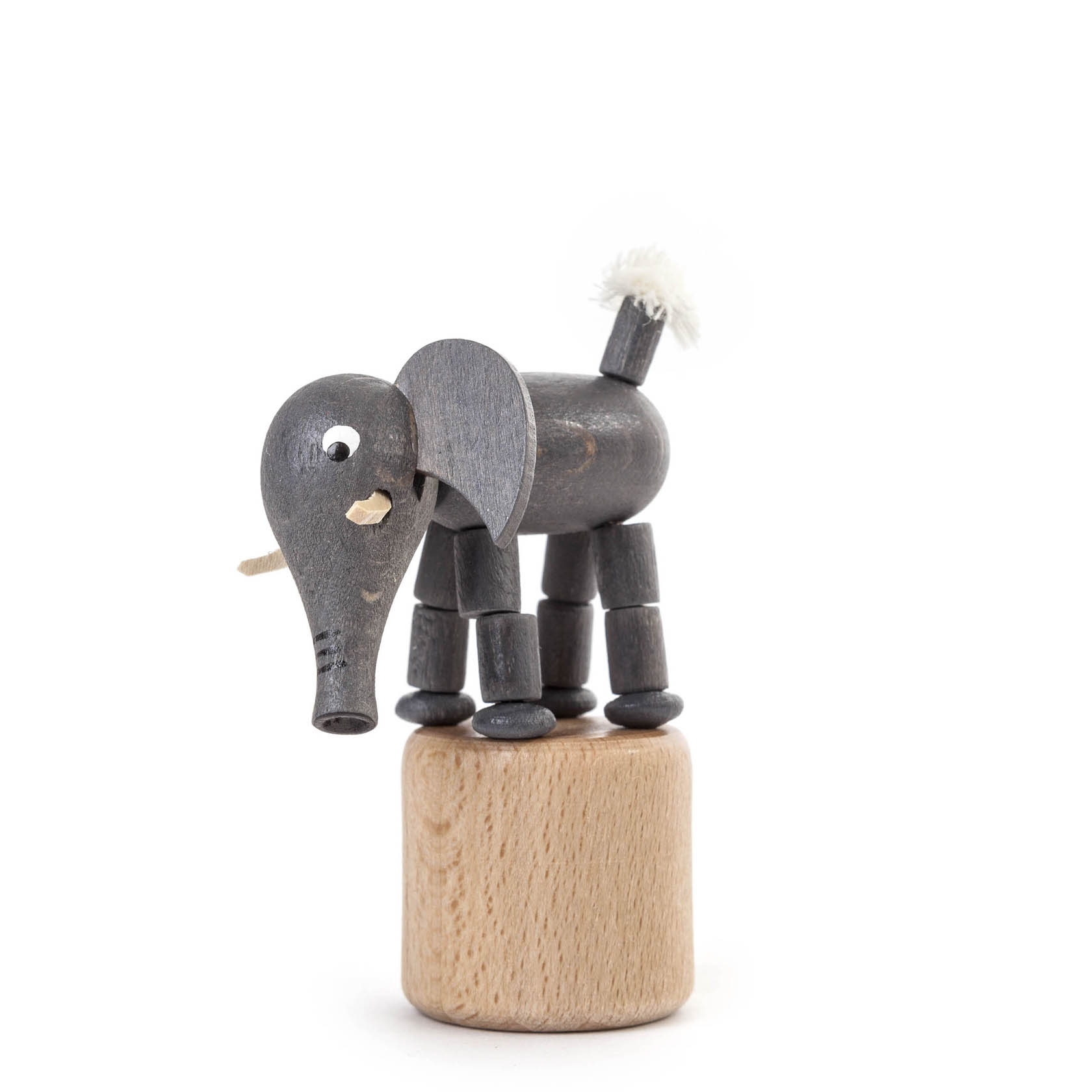 Wooden elephant figurine with movable legs and trunk on a round wooden base, resembling a wobble toy.