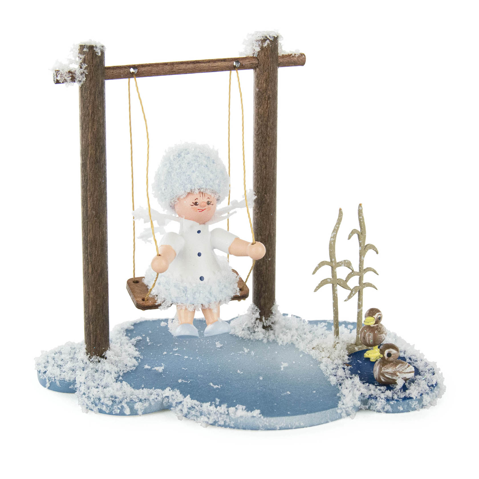 A small figurine of a snow fairy sitting on a swing, surrounded by a snowy base with a couple of birds and frosted plants. im Dregeno Online Shop günstig kaufen