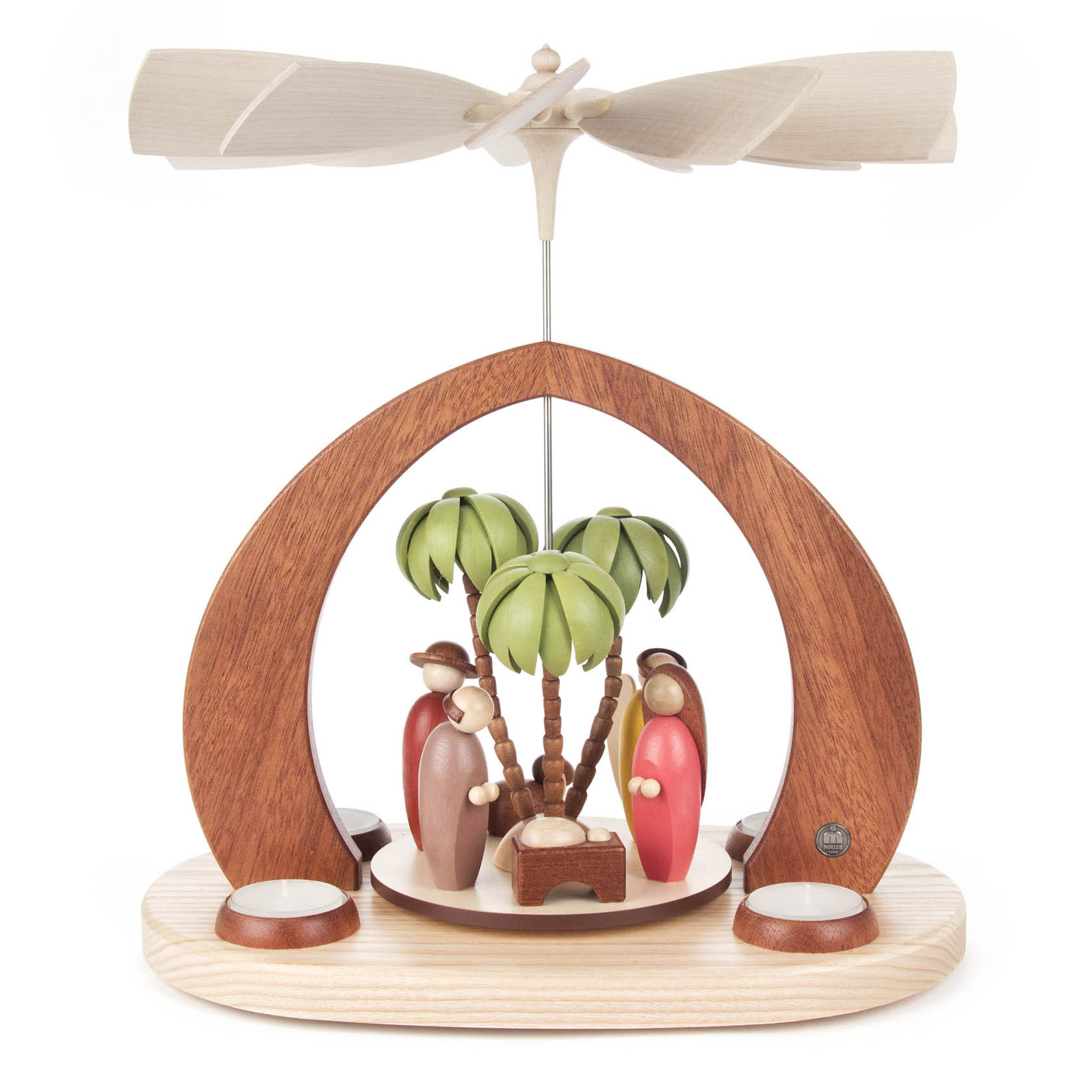 Colorful Christmas pyramid for tealights with a nativity scene featuring Mary, Joseph, and baby Jesus under palm trees, with a wooden arch and propellers. im Dregeno Online Shop günstig kaufen