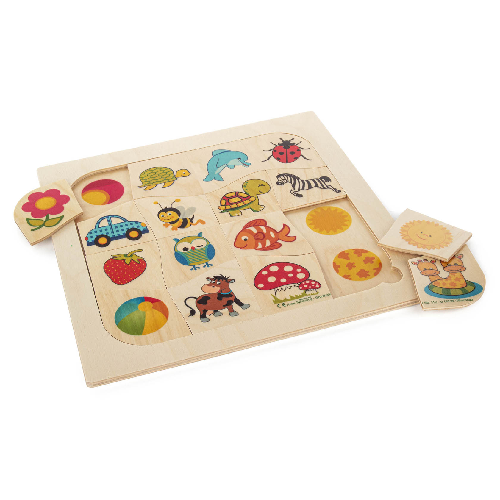Wooden matching puzzle with 16 colorful pieces, including animals, a car, fruits, and flowers. Two pieces are partially removed, revealing their slots.