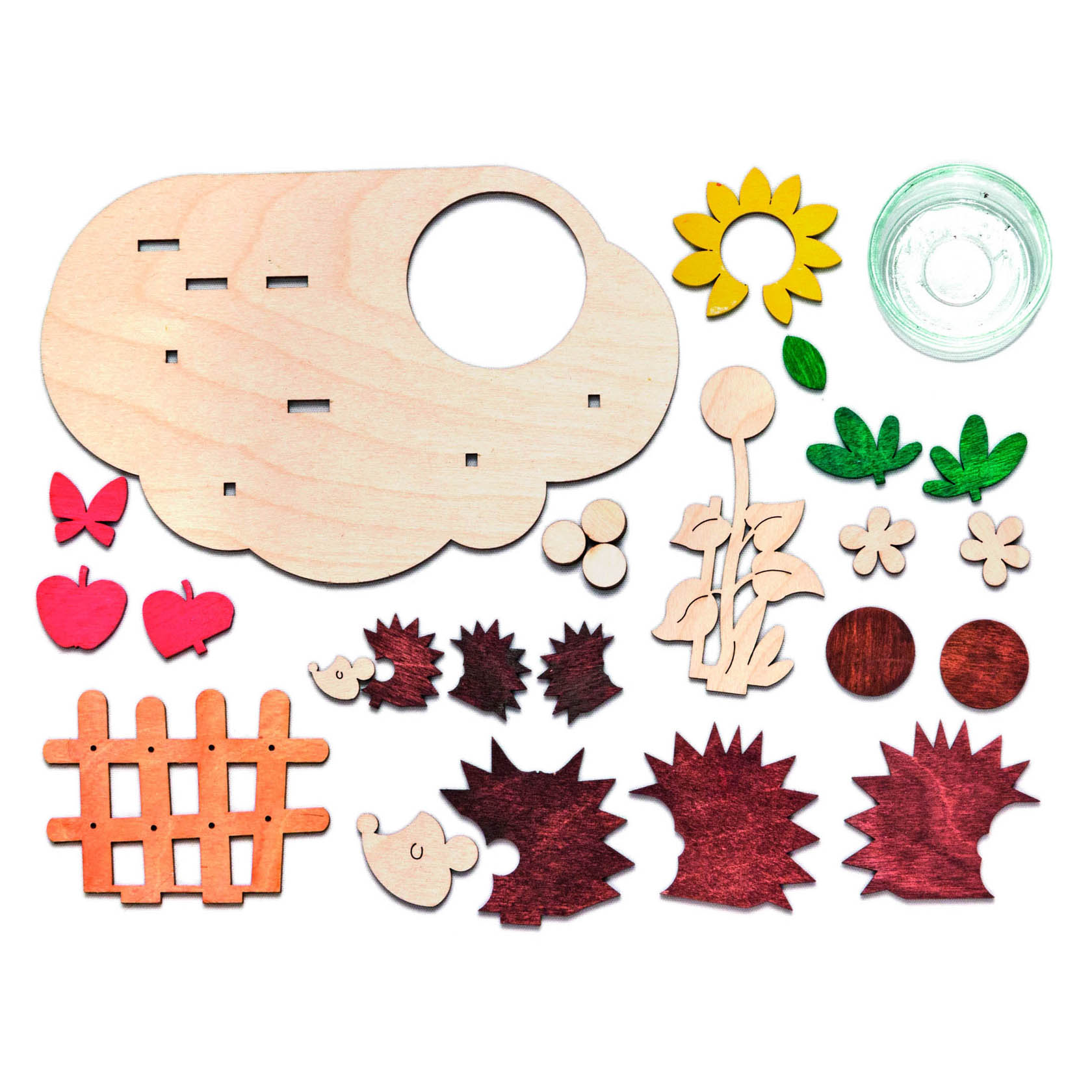 Bastelset für einen herbstlichen Teelichthalter bestehend aus Holzteilen: Basisplatte, Blumen, Tieren, Zaun und Glas für Teelicht, alles zum Dekorieren.