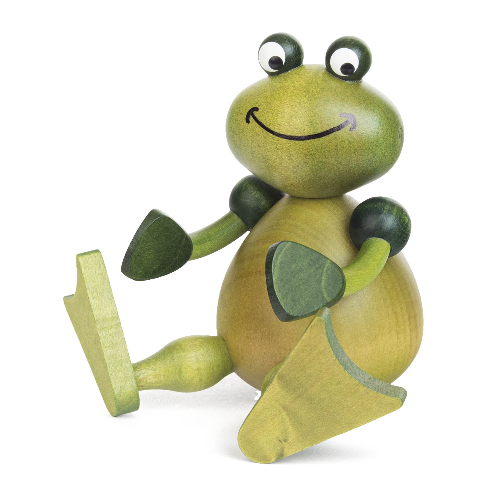 Holzfrosch mit großen Augen, grünem Kopf und Körper, dunkelgrünen Armen und Beinen, sitzend mit einem fröhlichen Lächeln. im Dregeno Online Shop günstig kaufen