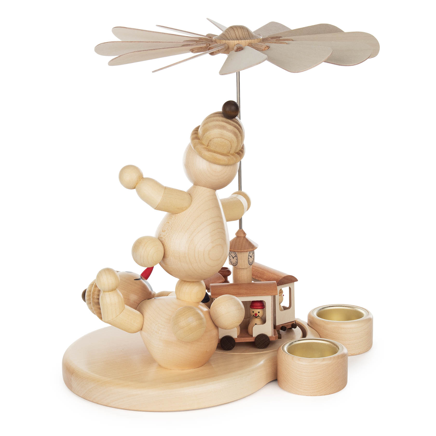 Wooden pyramid sculpture of two carved junior figures with a toy train, featuring rotating propeller blades and candle holders.