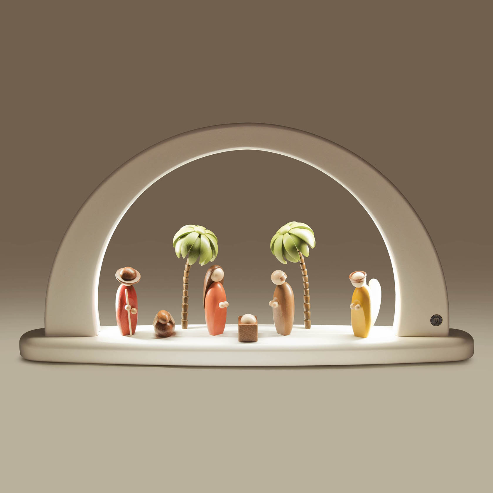 A white arch with LED lighting featuring a colorful nativity scene. Figures include Mary, Joseph, baby Jesus, and an angel with two palm trees.
